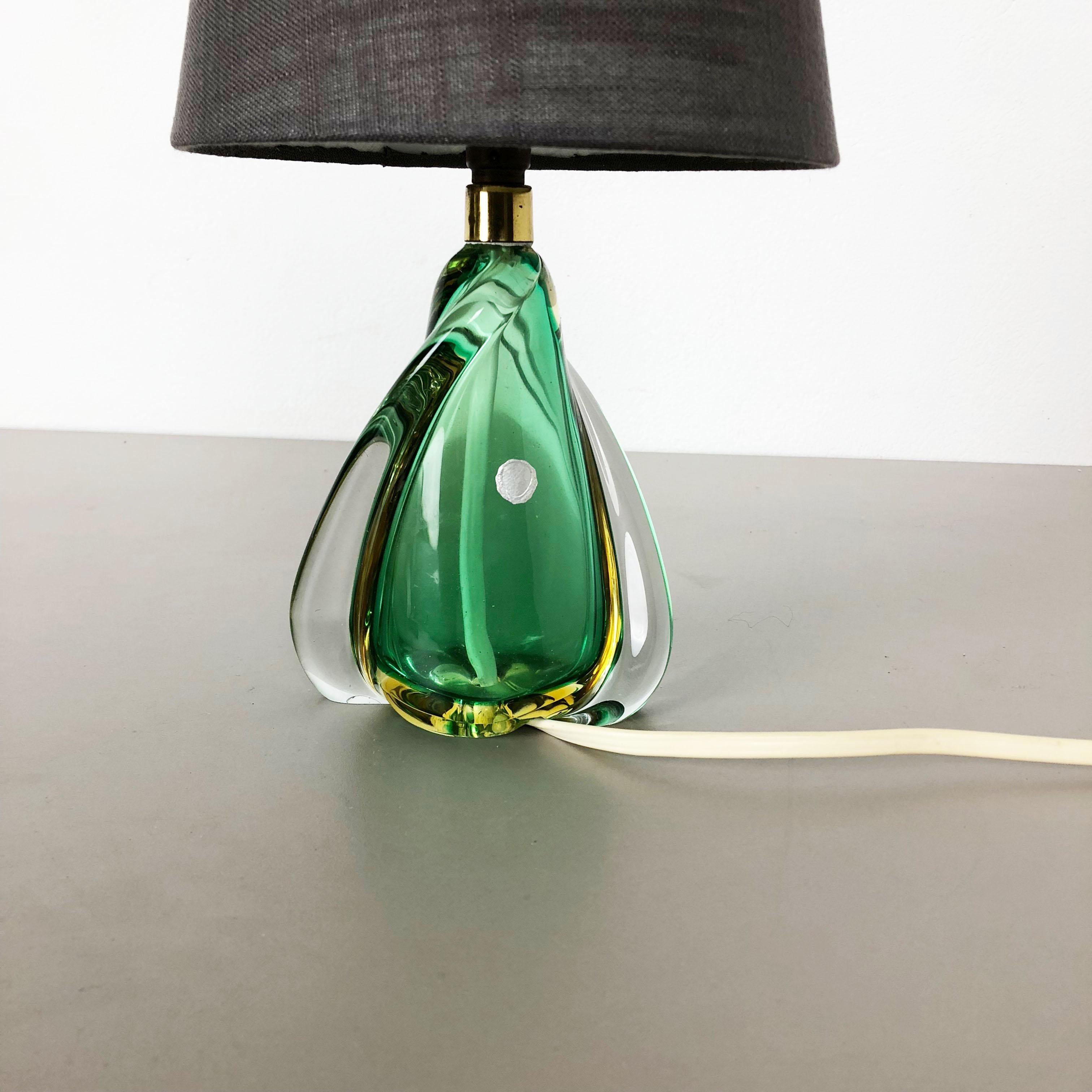 Article:

table light desk top light


Origina:

Murano, Italy


Age:

1960s




Description:


This fantastic vintage table light base was designed and produced in the 1960s in Murano, Italy. The light base is made of high