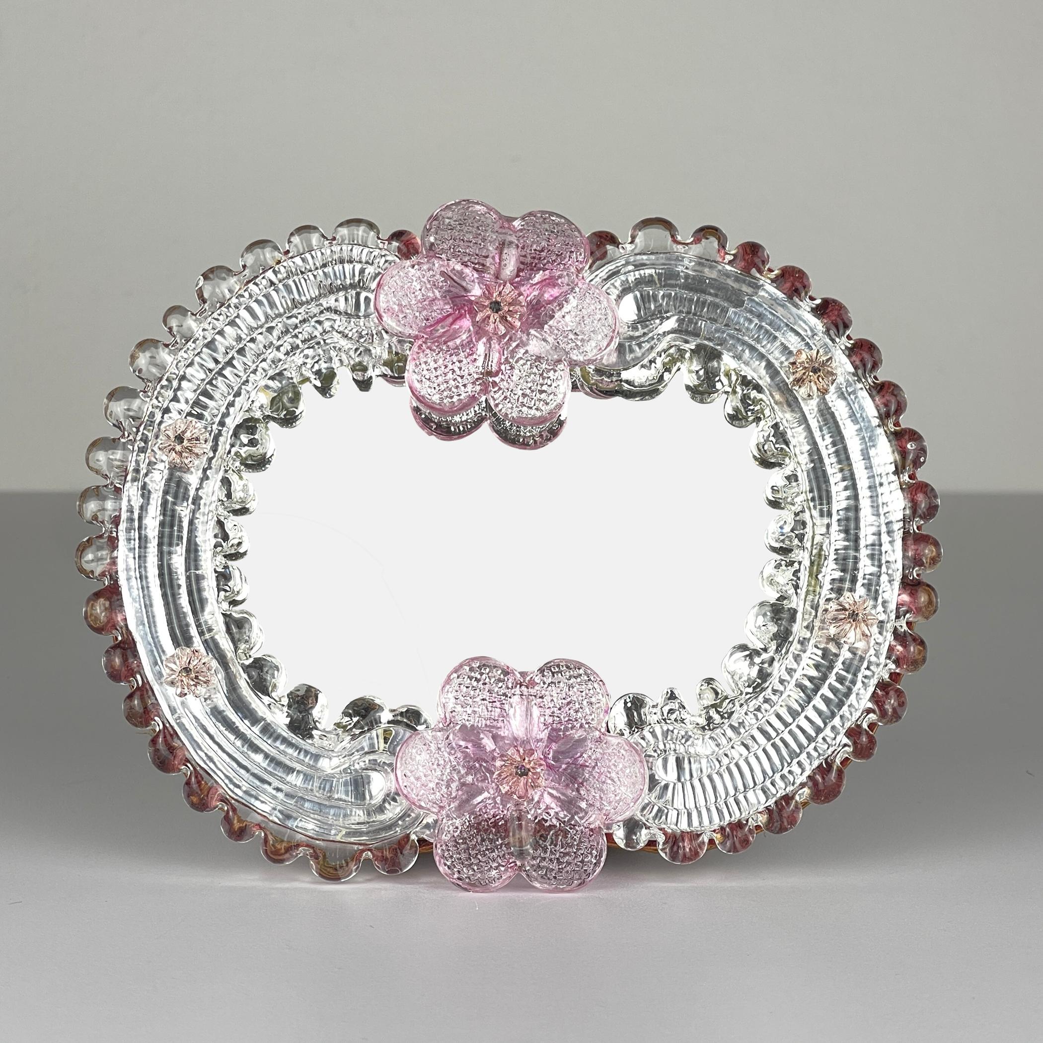 Charming Small Murano glass mirror made in Venice (Italy) in the 1950s.

Dimensions:
Width: 14 cm / 5.5 inches
Height: 18 cm / 7 inches

We offer a secure worldwide shipping. Each of our item is shipped in a personal custom-made wooden box.

If you