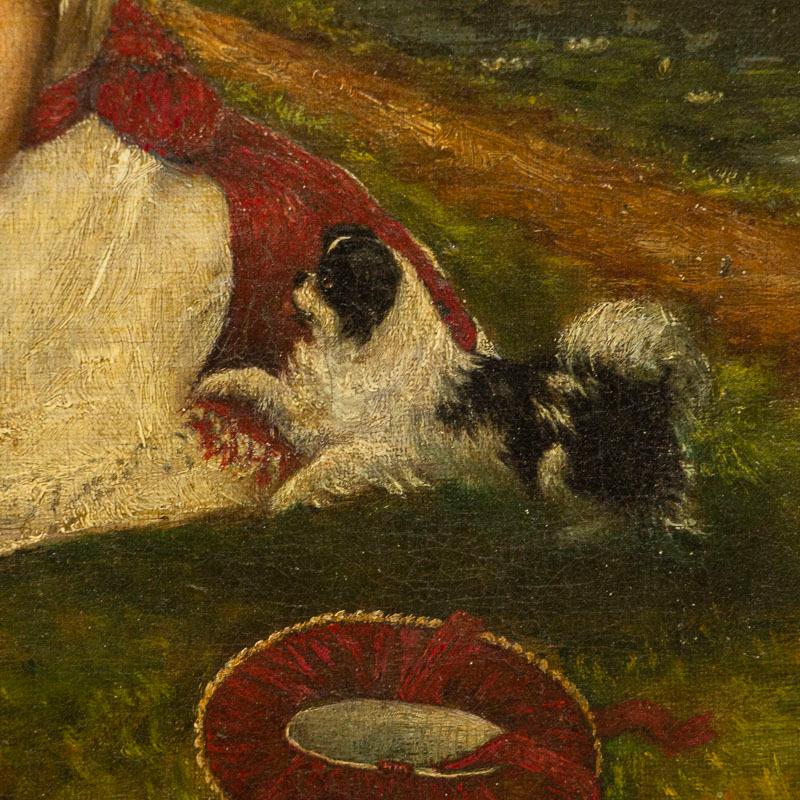 20ième siècle Petite huile sur toile originale représentant une fille et des chiens en vente