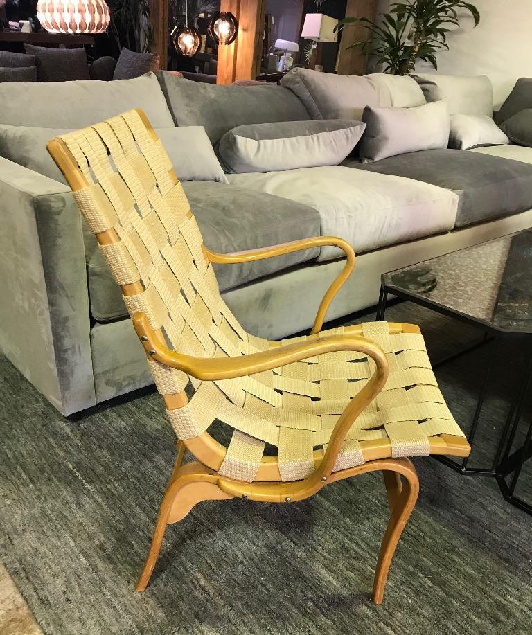 Iconic in design and style. This original chair is a beautiful example of renowned Swedish designer Bruno Mathsson most recognizable work.

Signed with all the requisite stamps/markings.

A great addition to any Mid-Century Modern collection or