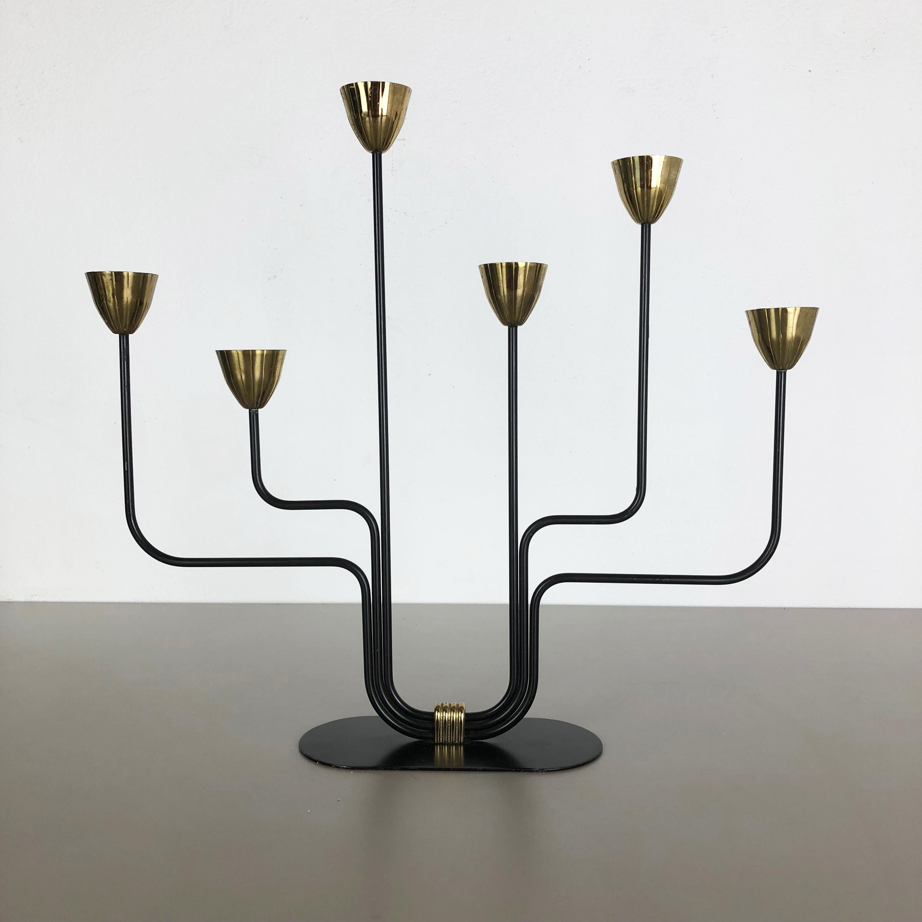 Article:

Candleholder element


Producer:

Ystad Metal, Sweden


Decade:

1960s

Original modernist candleholder produced by Ystad Metal in the 1960s in Sweden. It is made of solid metal and features six holders for candles, the base