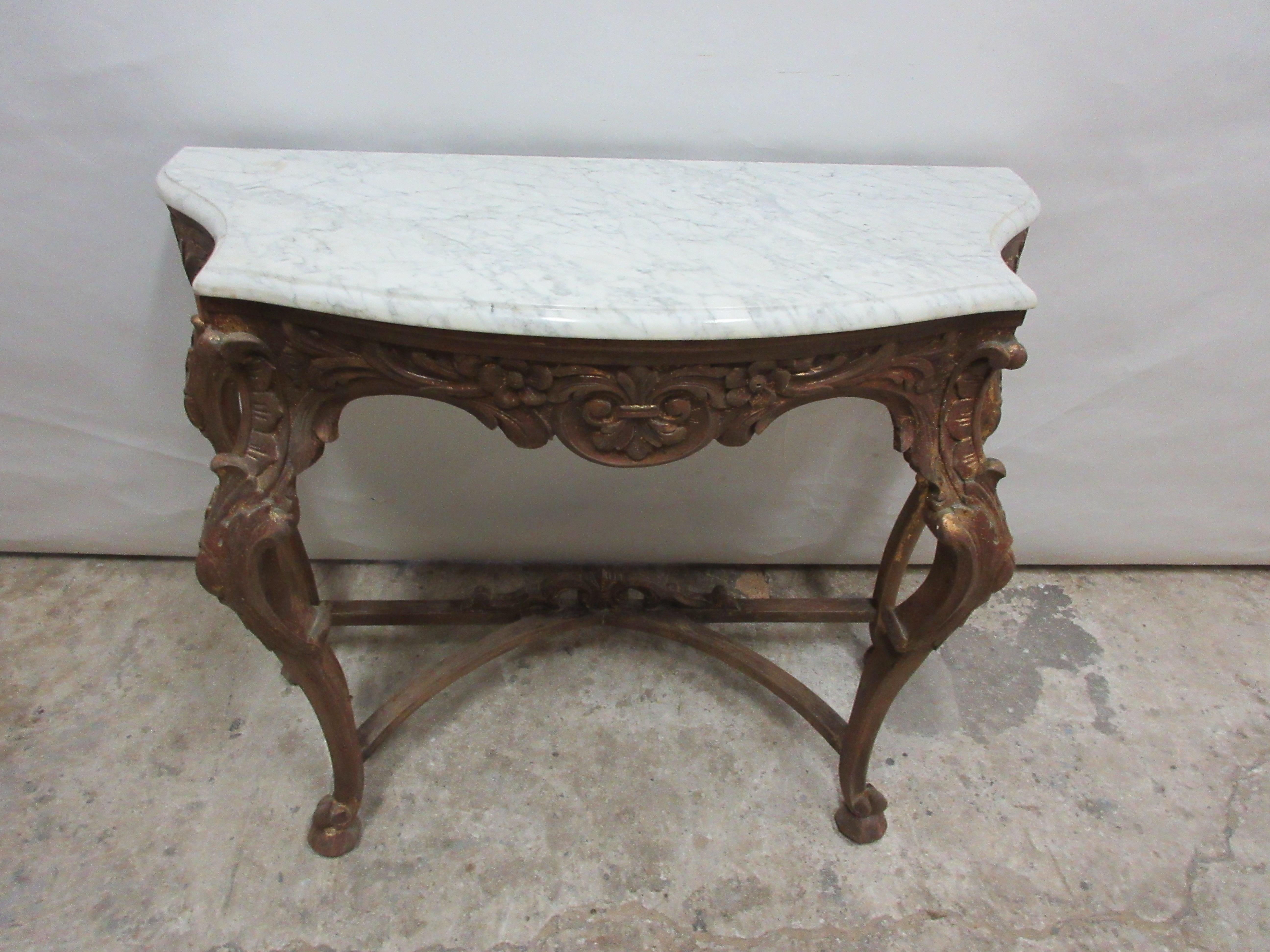This is an original Swedish Rococo console table with a stone top.