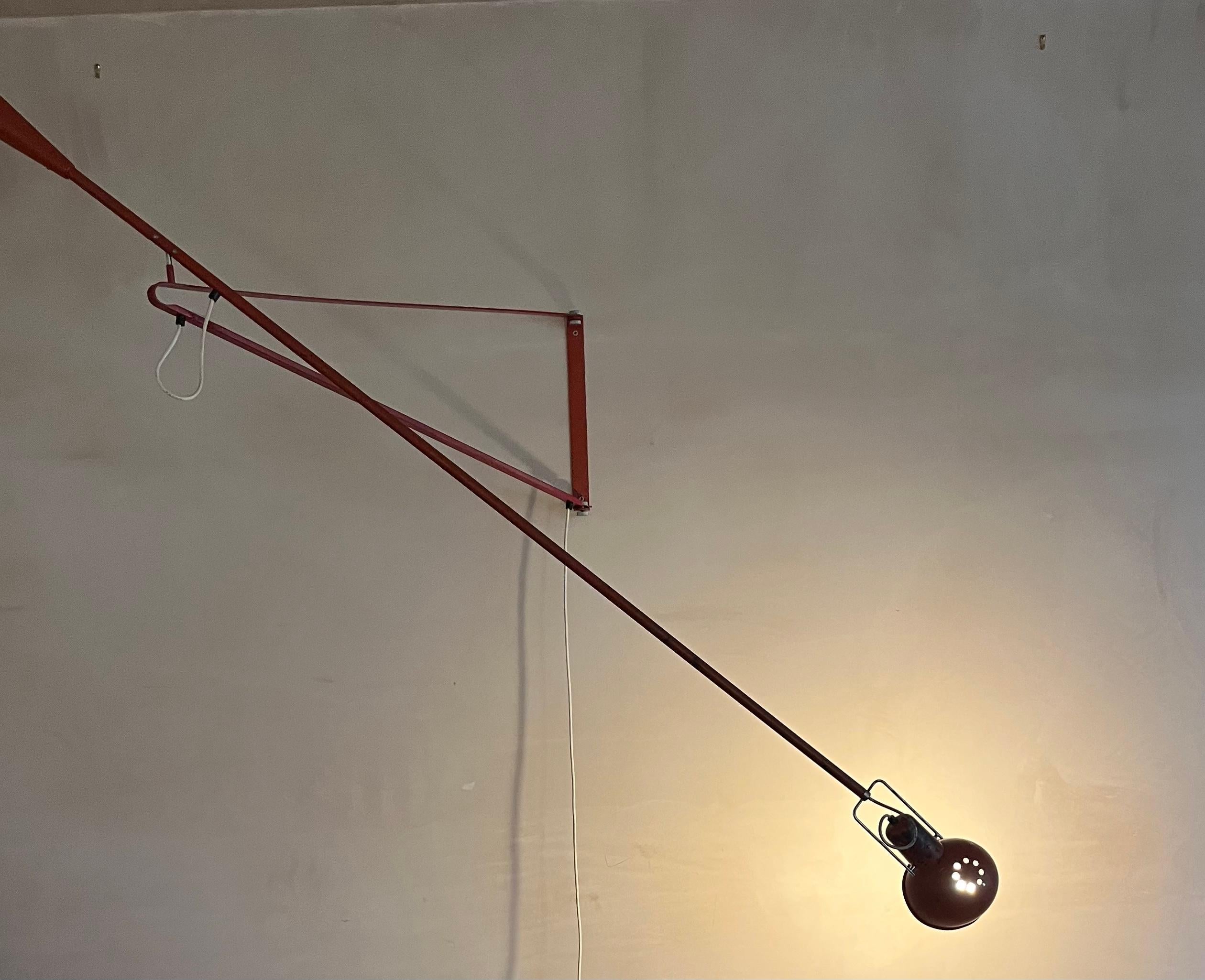 Italian Original swing arm wall light by Paolo Rizzatto Model 265 produced by Arteluce.
