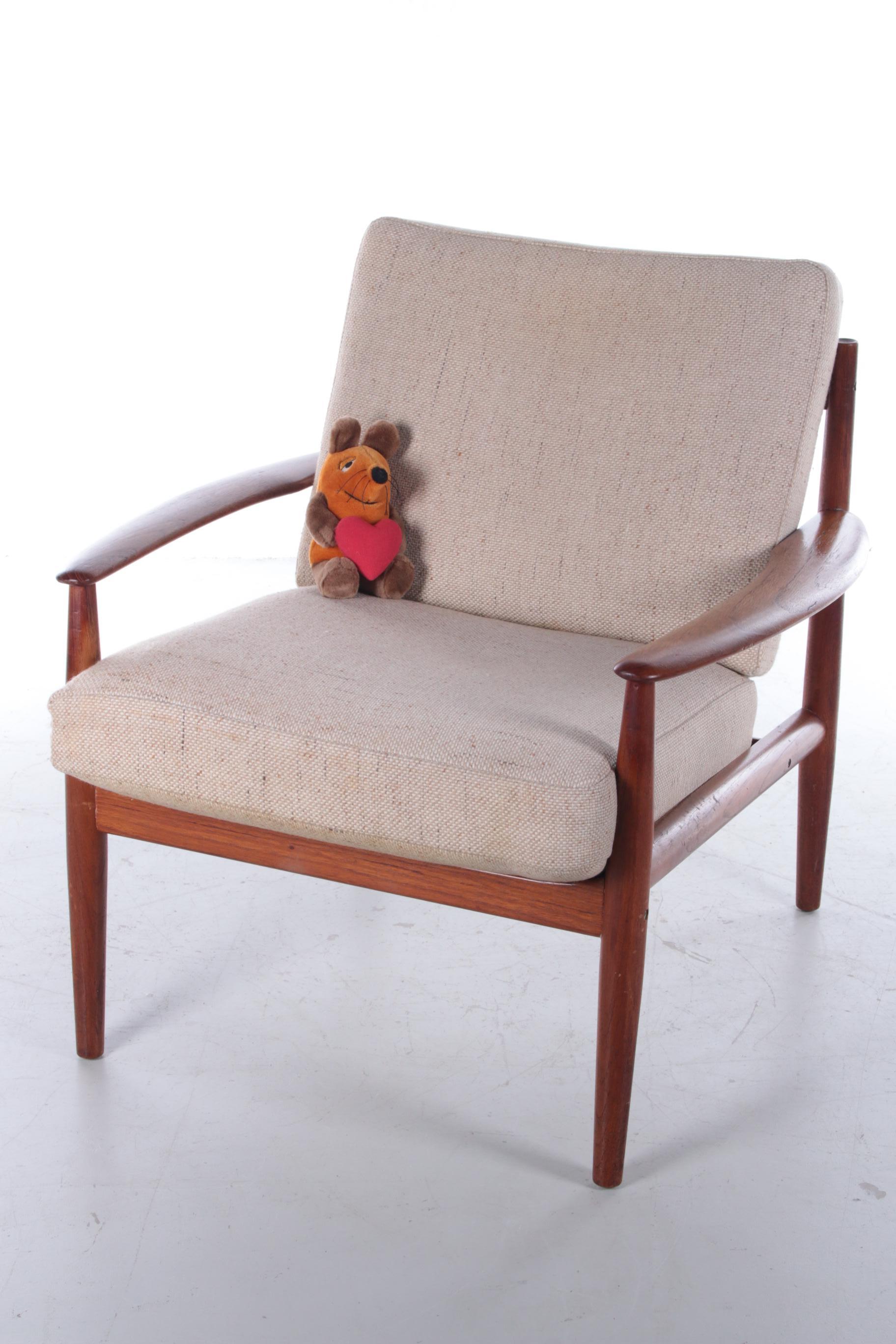 Original teak armchair design by Greta Jalk Model 118, Denmark.

Beautiful vintage teak wooden model 118 armchair. The armchair was designed by the Danish designer Grete Jalk and produced by France and Son. The frame is made of solid teak and has