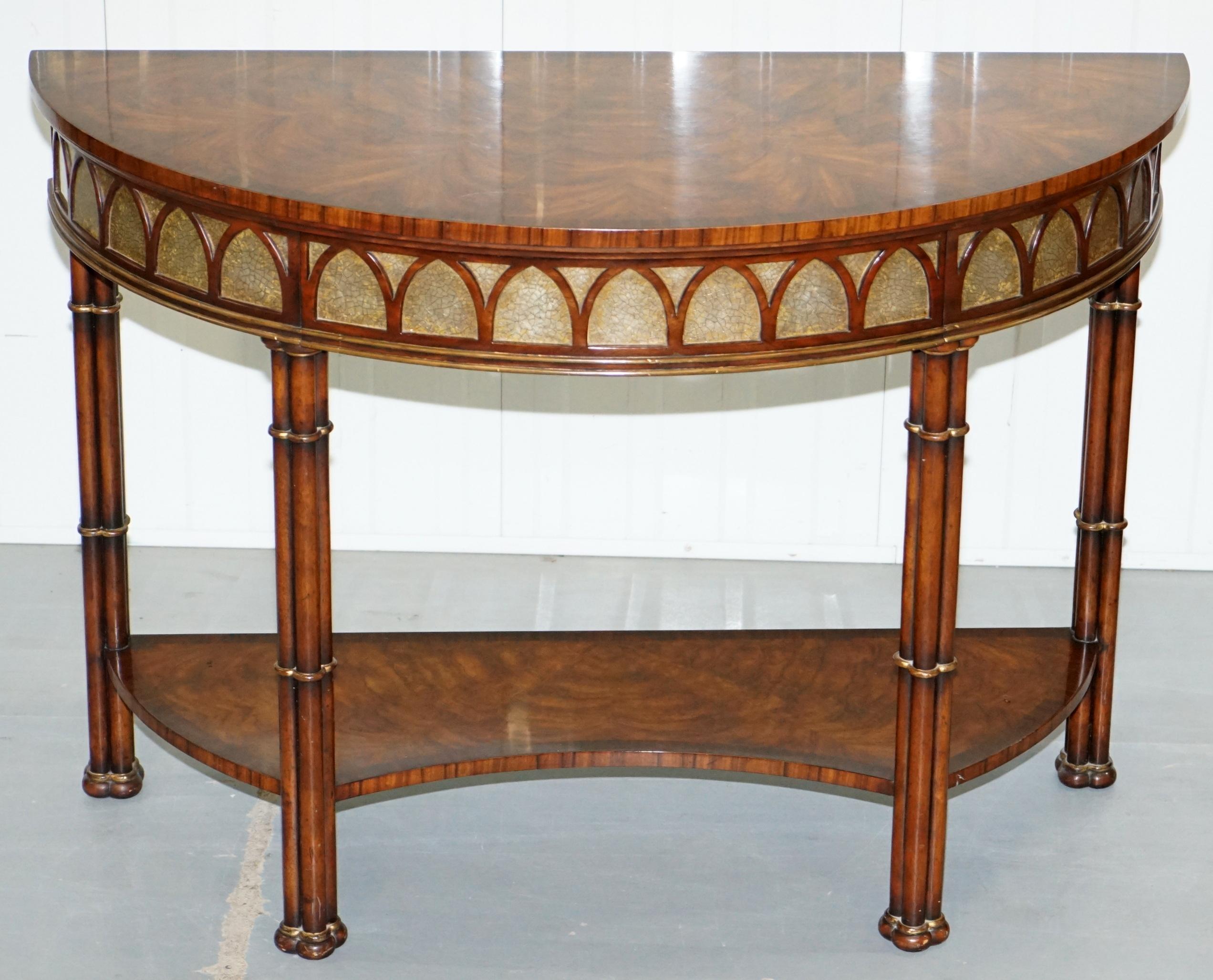 We are delighted to offer for sale this very ornate Theodore Alexander Demi Lune console tables made in the style of Thomas Chippendale.

A very good looking and well-made piece, the luxury timber is exotically patinaed throughout, the top looks