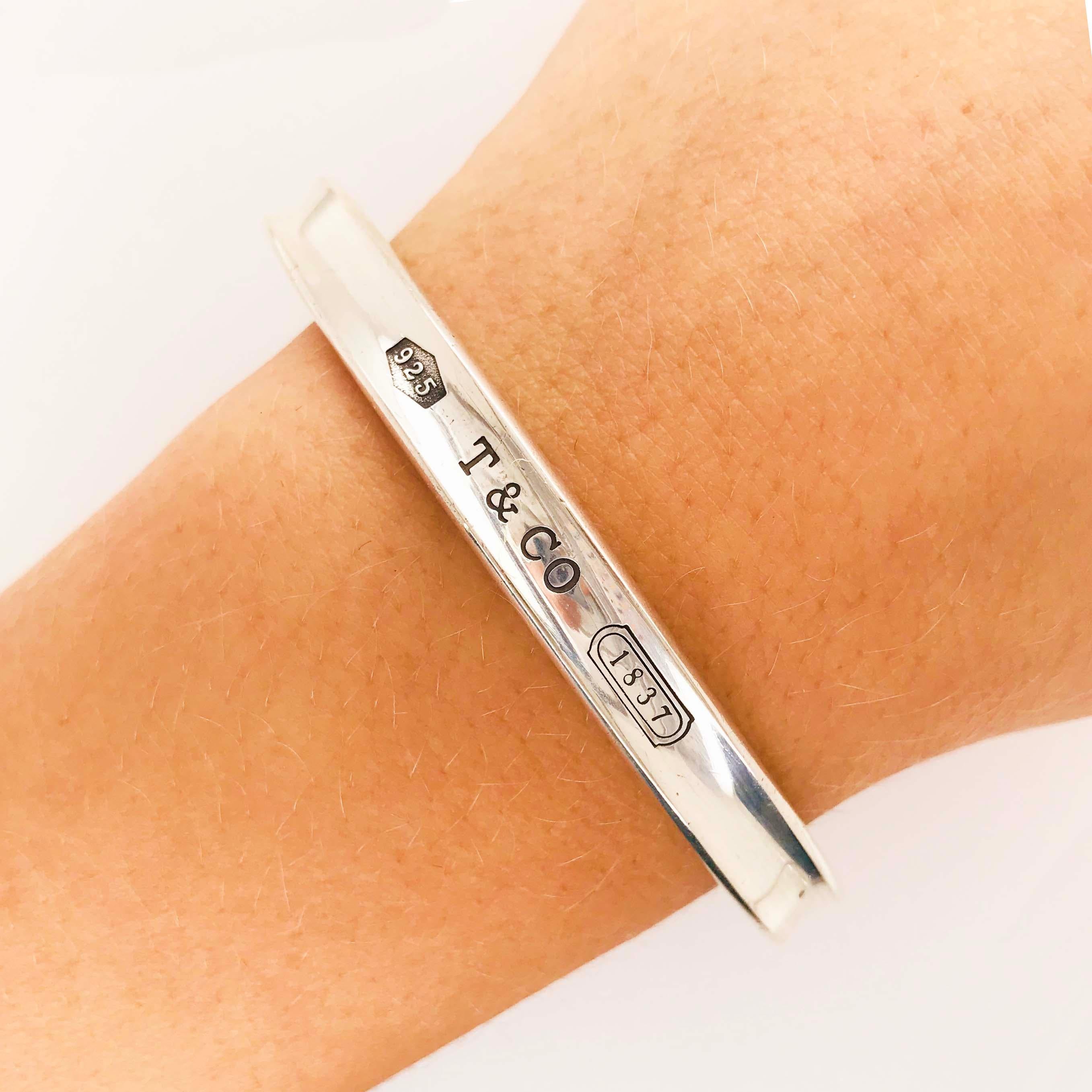 This gorgeous sterling silver bangle bracelet is an original, authentic Tiffany & Co. bangle bracelet. The bangle bracelet is an original 1997 Tiffany & Co.  from the Tiffany & Co. 1837 collection and is a concave design with a sleek, classic