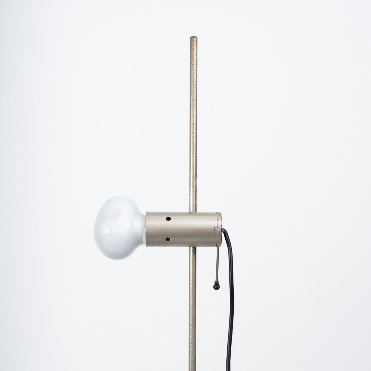 Model 387 floor lamp by Tito Agnoli for Oluce, Italy, 1954. Early edition, featuring a nickel-plated steel pole with original Cornalux ‘hammerhead’ light bulb on a travertine base. Pair available.

Patina of age. Original bulbs. Rewired and PAT