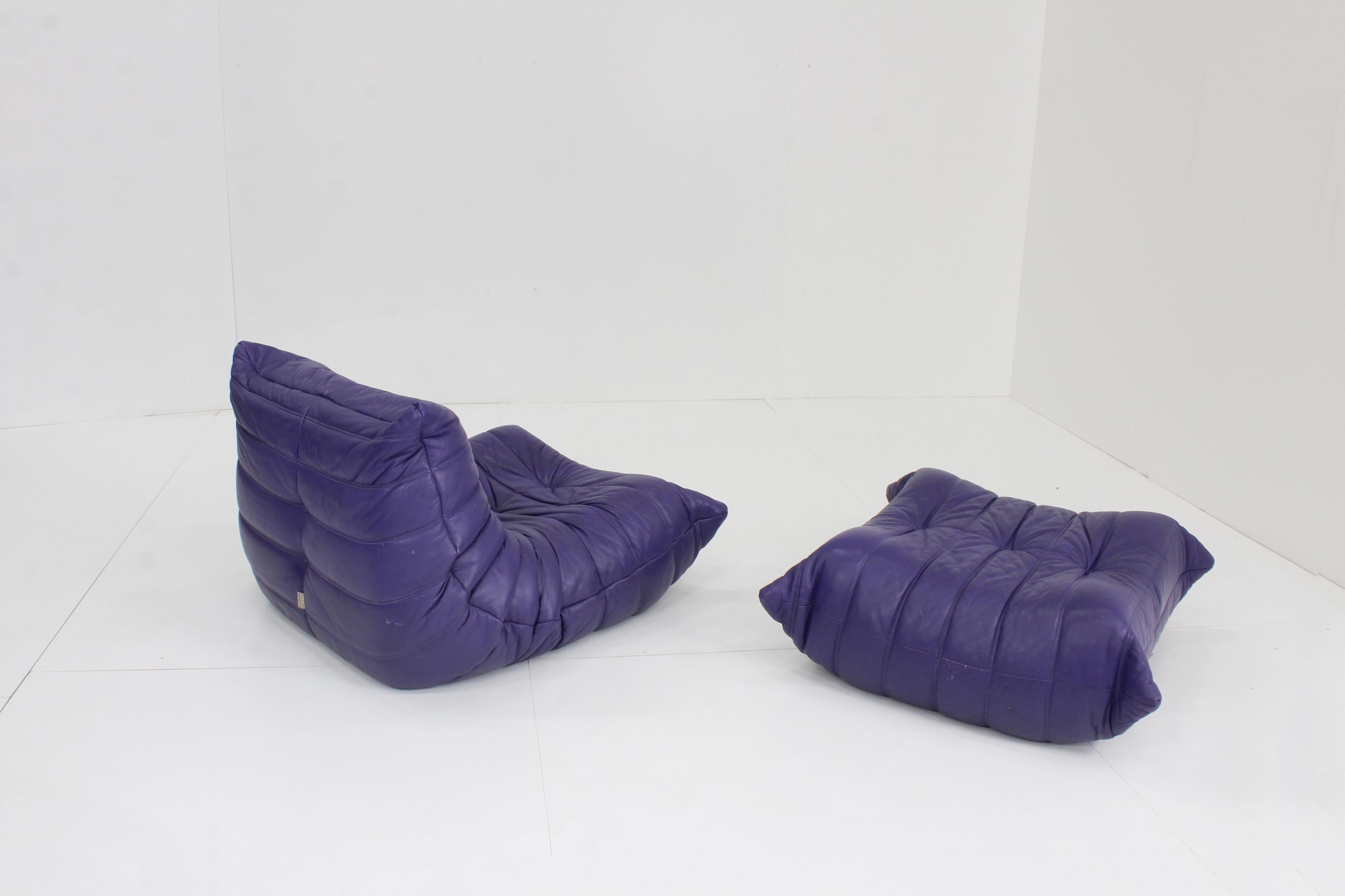Original Togo ligne roset purple leather armchair with ottoman, 1990s.

Togo ligne Roset purple leather fireside chair with ottoman from the 1990s. This is an original piece in its original purple leather. Very rare find. Designed by Michel
