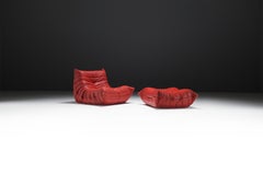 Original Togo & poof (2007) in red leather by Michel Ducaroy for Ligne Roset.