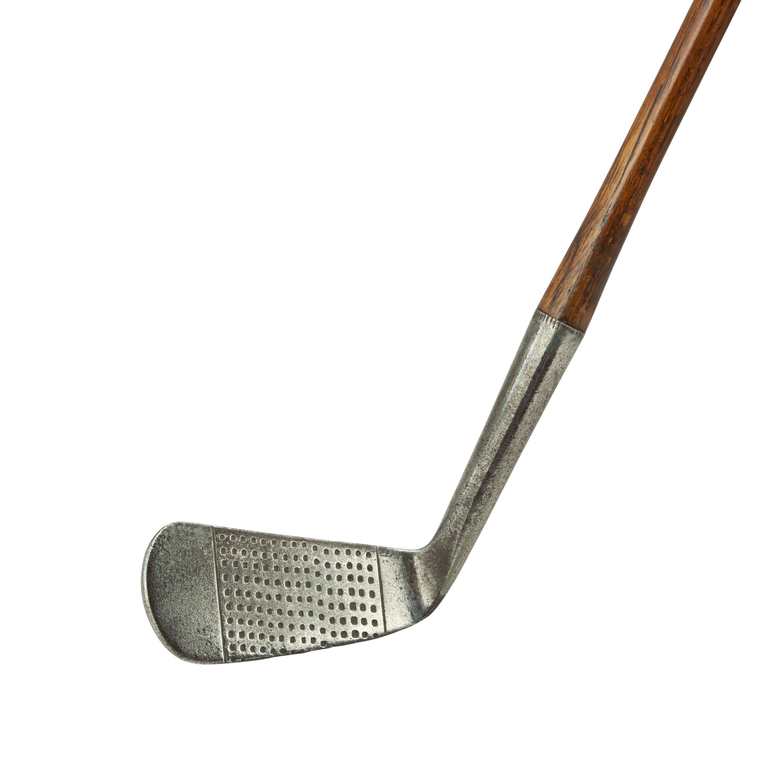 Vintage hickory golf club by Tom Stewart, St Andrews.
A diamond back Mid iron by Tom Stewart of St. Andrews and retailed by Lane Crawford Ltd., Hong Kong. The hickory shaft stamped 'T. Auchterlonie, St Andrews, and fitted with a suede leather grip.