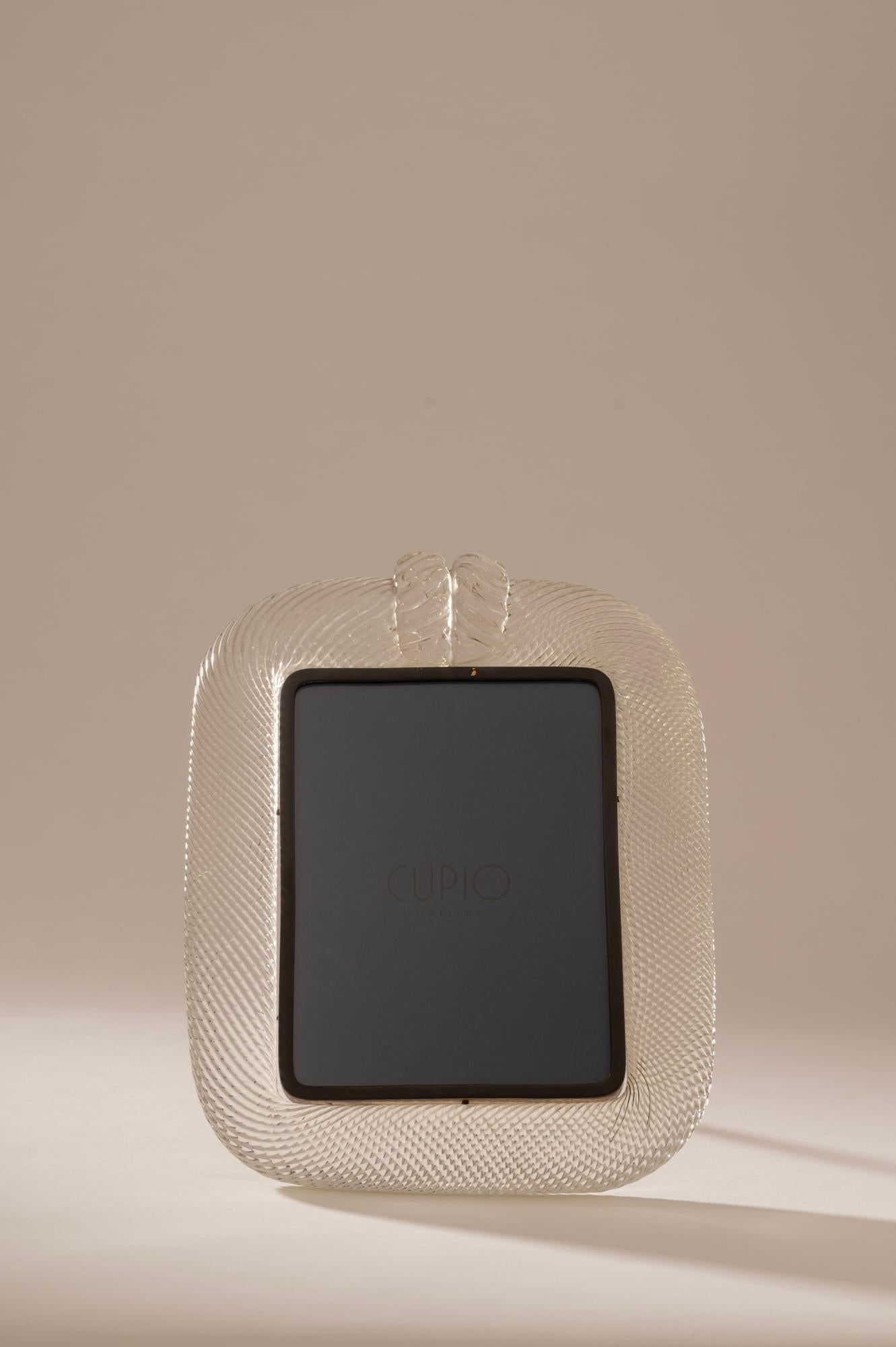 An original 1930s 'Torciglione' clear glass picture frame produced by one of the most prestigious glass manufacturers in Italy, Barovier & Toso. The wonderful craftsmanship of this photo frame, along with quality of the glass itself make this a very