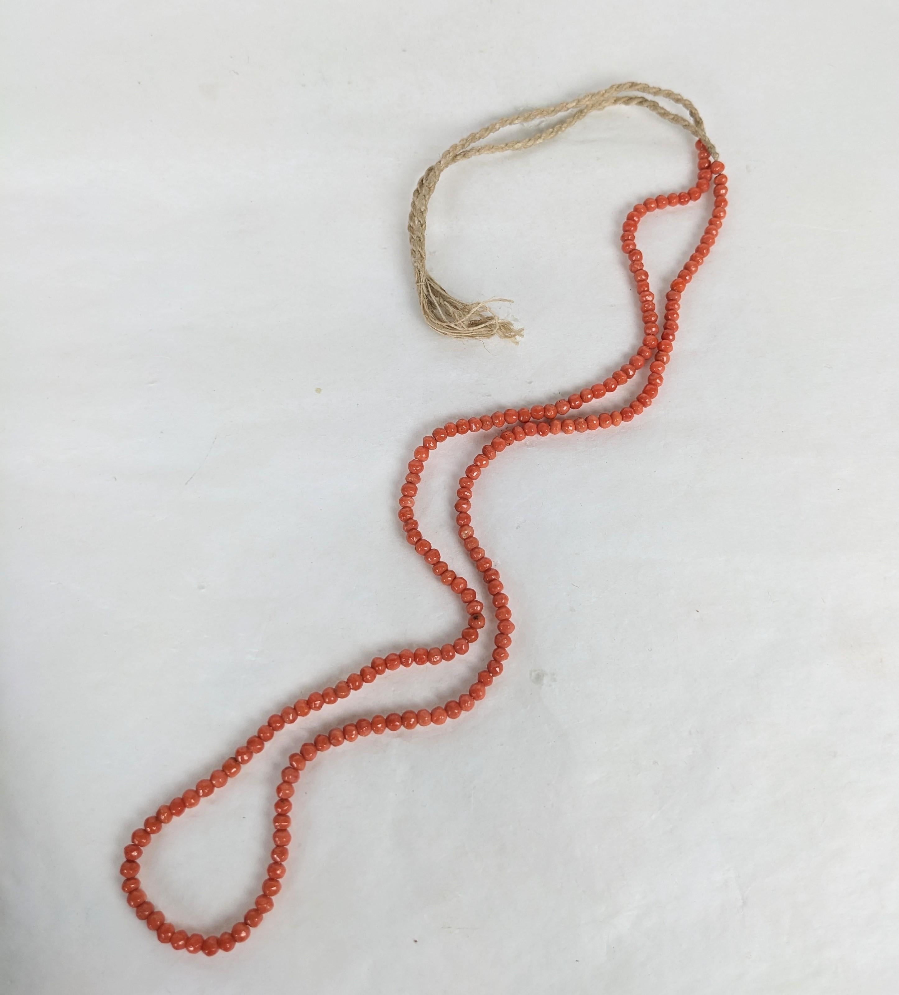 Charming Victorian Coral Beads on original cotton cord from a period jewelers lot. Genuine coral beads, great to wear loosely tied on back or with a pendant or brooch clipped on. 1870's Italy. 
Coral beads 20