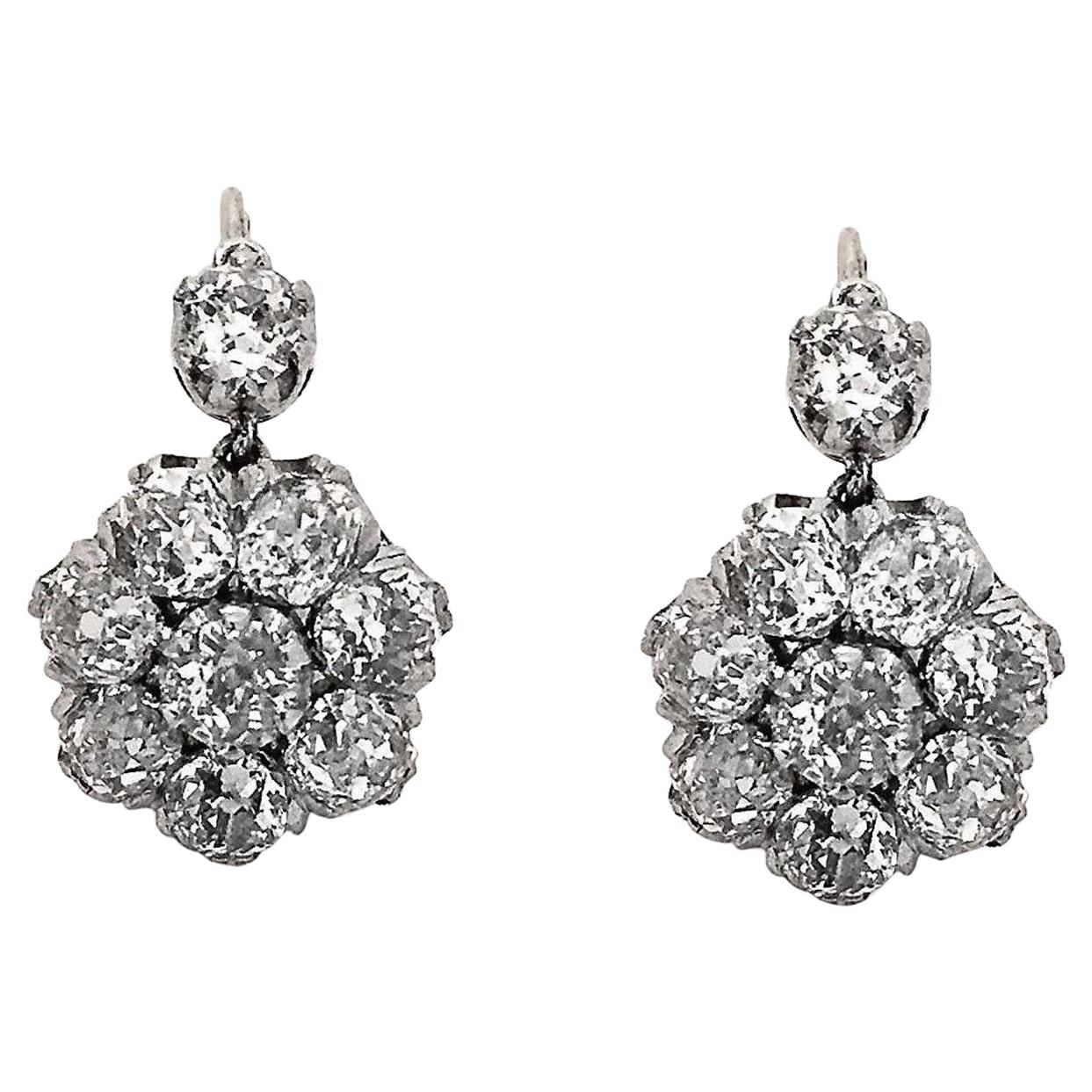 Original Victorian Flower Cluster Diamond Drop Earrings. Perfect for everyday wear into the evening!
All original, we love the front closure true to the Victorian era. 
Approximately 3.50 CTW of old mine diamonds set into a flower cluster dangling