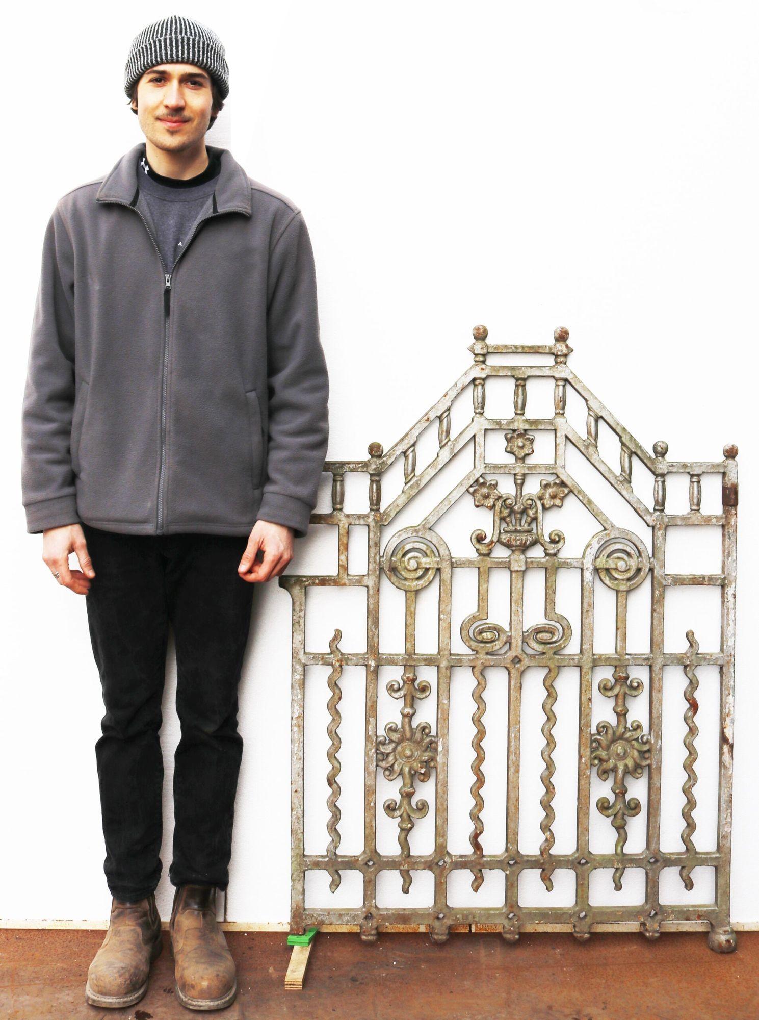 A Victorian cast iron gate featuring a decorative design.