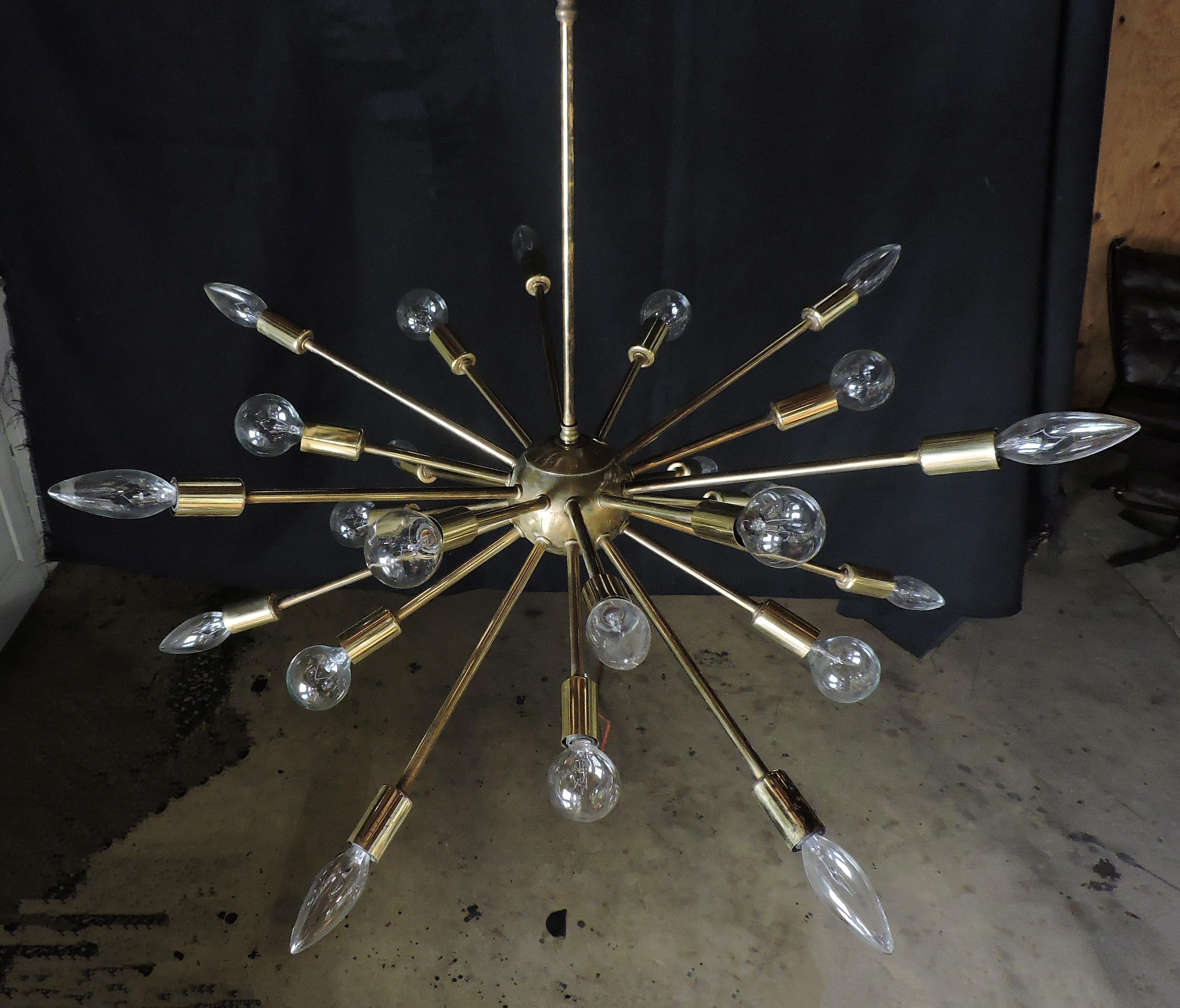 Striking Sputnik chandelier with 24 arms. This original 1960s fixture has a great look and a nice patina to the metal. A ceiling cap is included.