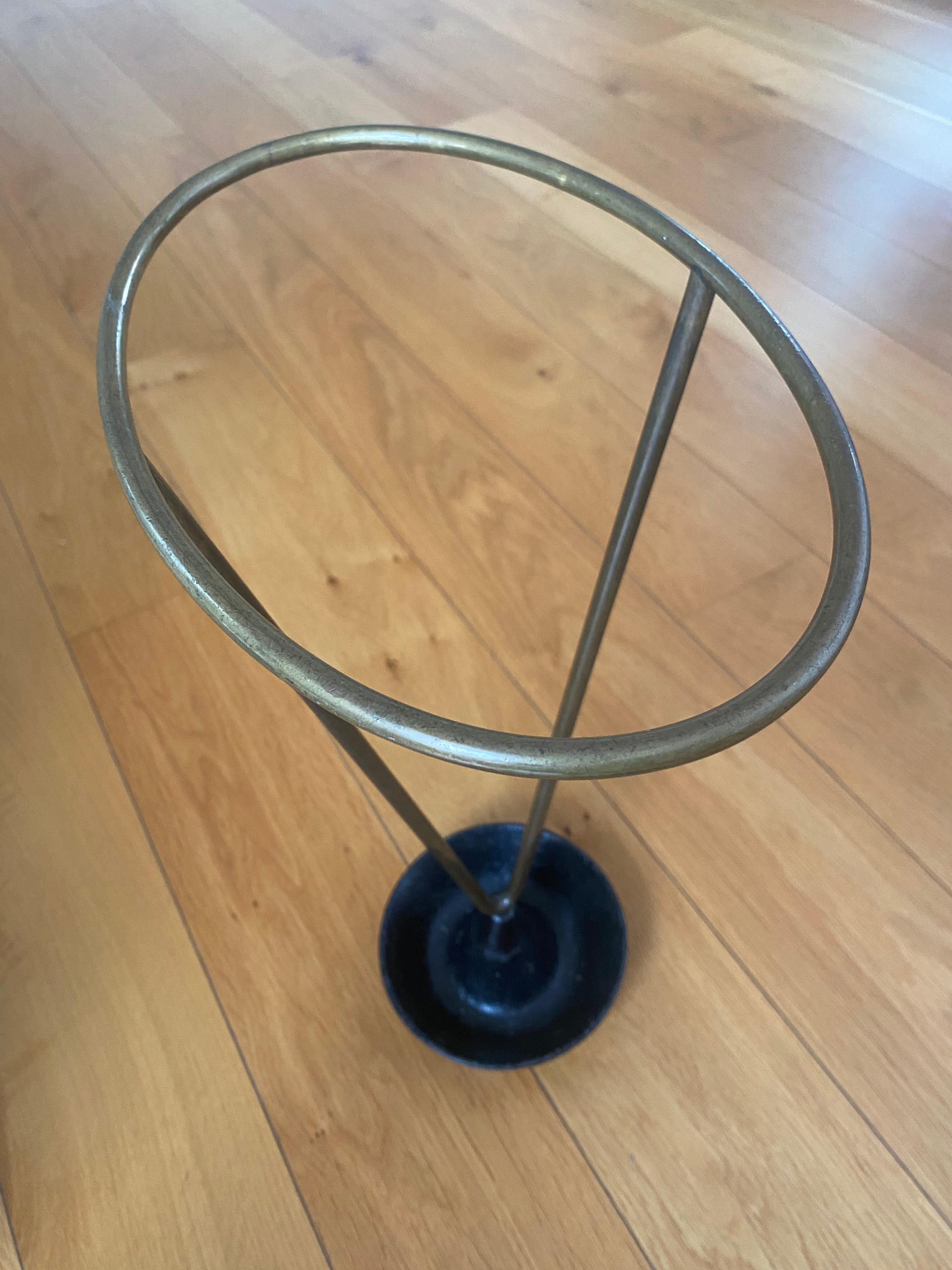 Carl Auböck vintage umbrella stand from brass and cast black lacquered iron Model # 4293 by Carl Auböck for Workshop Carl Auböck with beautiful patina. Stamped Auböck. Authentic piece in original condition with beloved signs of age and use like