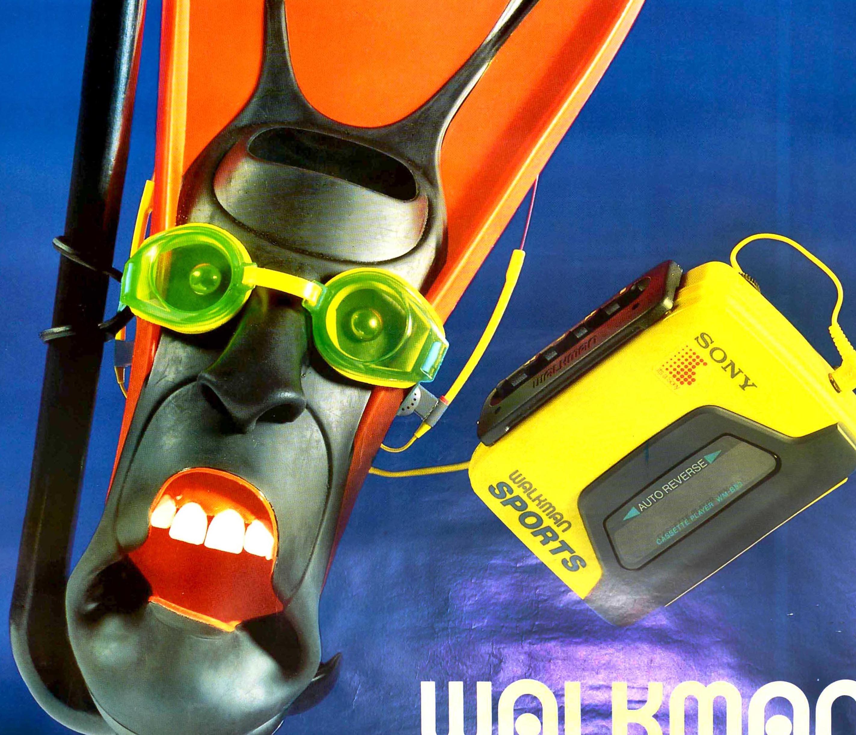 Original vintage advertising poster for Sony Walkman Sports cassette player featuring a fun design depicting a swimming image of an orange and black flipper / fin wearing goggles with the foot forming the shape of a face listening to music with