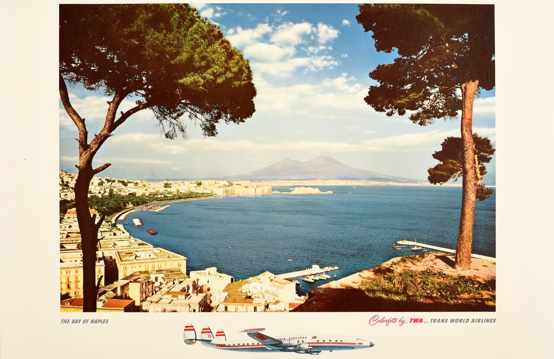 Original vintage travel advertising poster - Along the way of TWA ... Italy The Bay of Naples Trans World Airlines - featuring a view over the Gulf of Naples towards Mount Vesuvius with the town along the peninsula, boats in the harbour on the calm