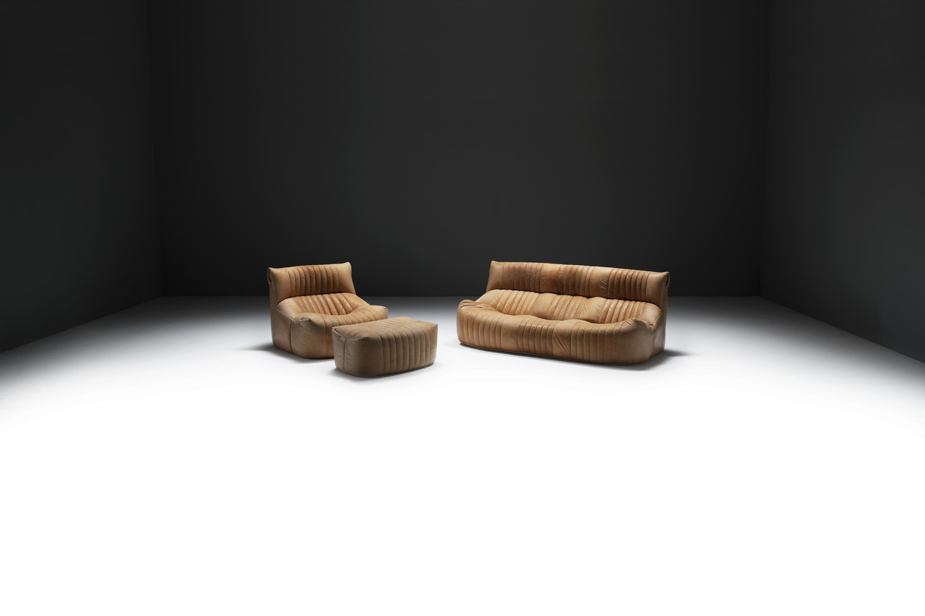 Aralia Sofa Set by Michel Ducaroy for Ligne Roset, 1981
Natural Leather Upholstery on Soft Sculptural Foam Base

Designed by Michel Ducaroy for Ligne Roset, the Aralia is a rare and collectible lounge set from the early 1980s. This example,