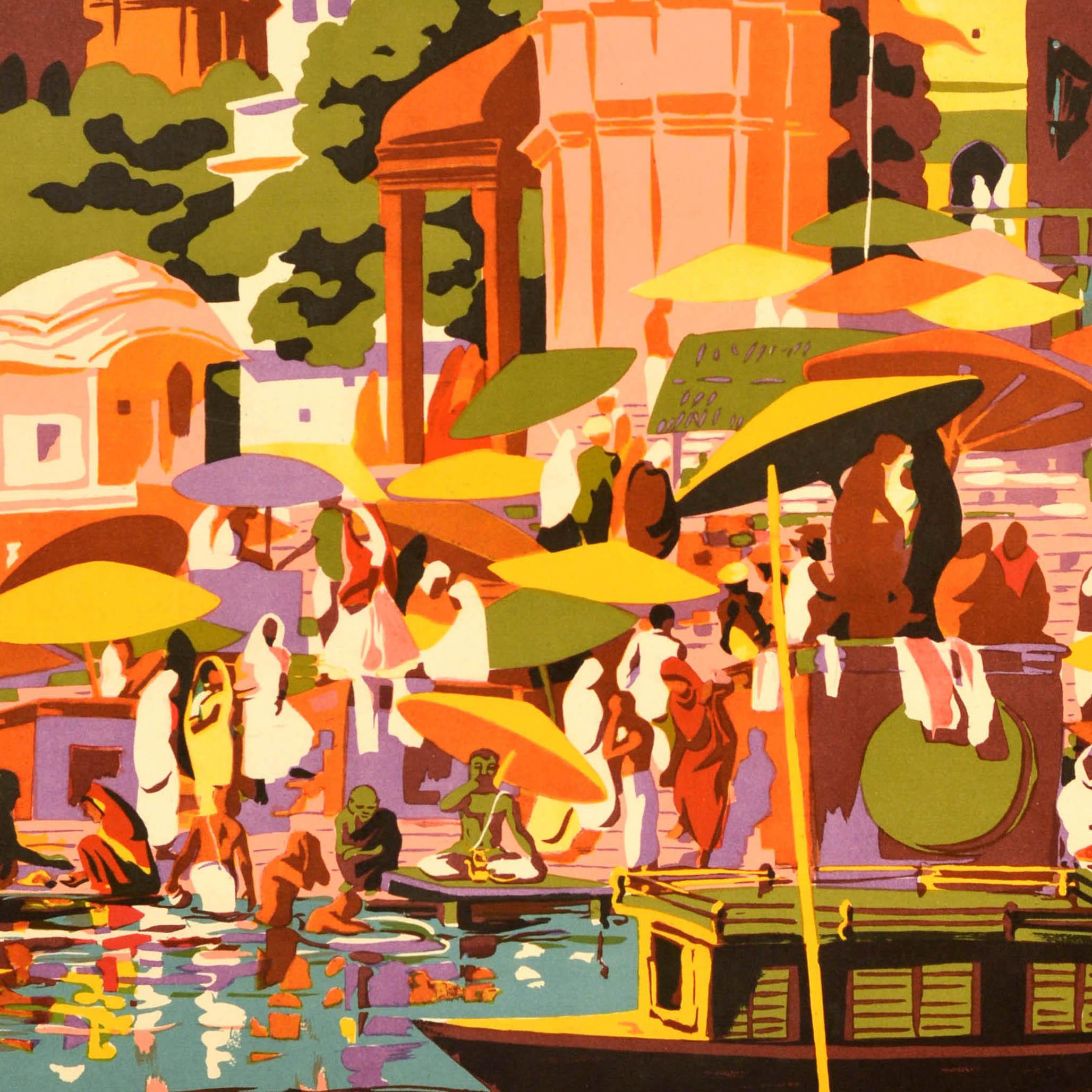 Original vintage travel poster for Varanasi / Banaras in India featuring a colourful mid-century design showing people in traditional clothing and sari dresses under umbrellas against the sun on the ghats / riverside steps of the Ganges with trees