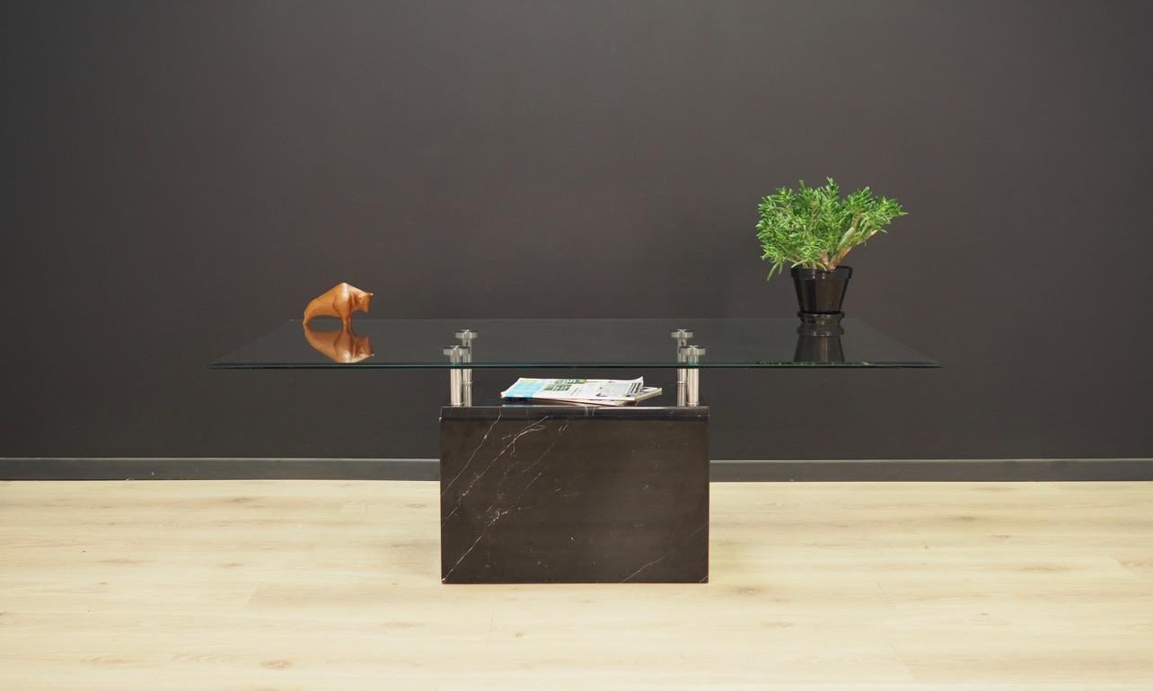 Original coffee table of the 1960s-1970s. Fantastic platform made of marble and the top of glass. Table in good condition - directly for use. 

Dimensions: Height 50 cm, tabletop 140 cm x 80 cm.