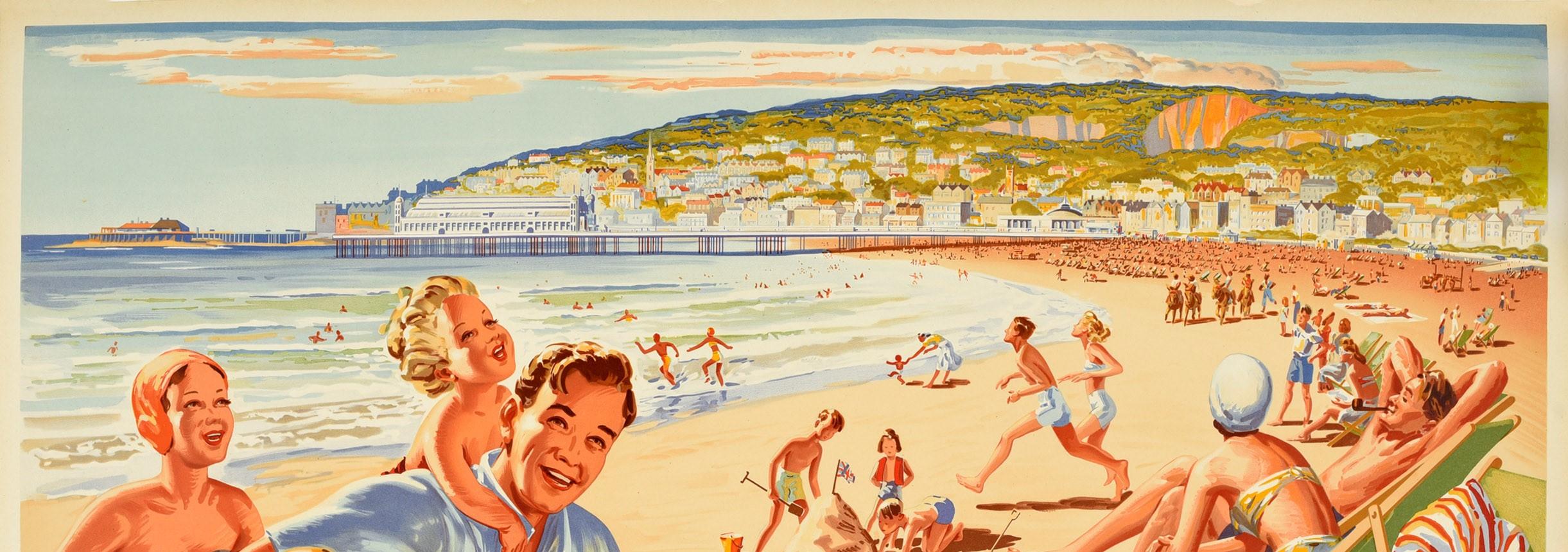 Original vintage travel poster advertising Weston-Super-Mare The Smile in Smiling Somerset published by British Railways. Fantastic summer illustration of people enjoying their beach holiday with a happy family in the foreground - the father giving
