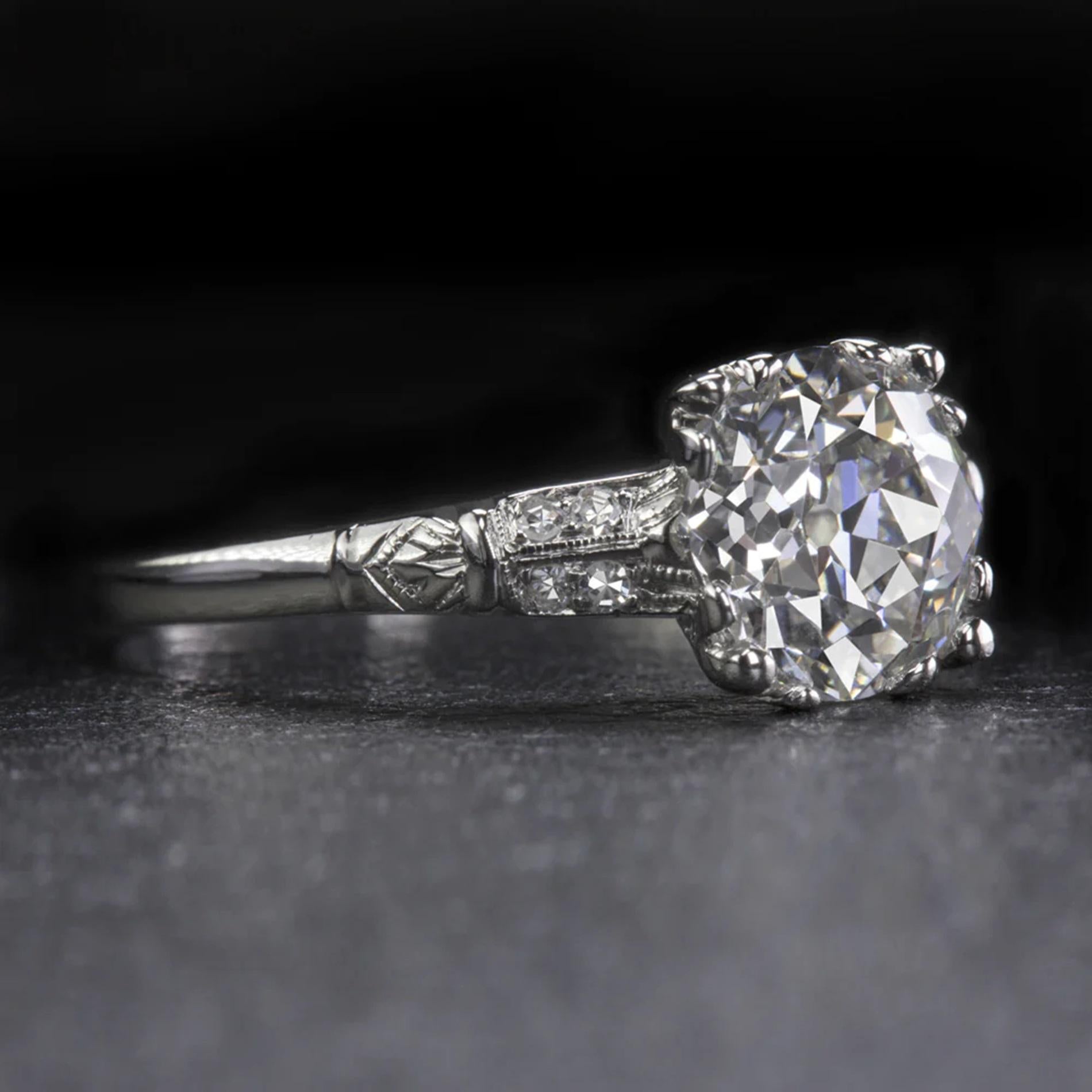 Discover the timeless elegance of this stunning original Art Deco diamond ring, a piece that truly stands out with its exceptional quality. At the heart of this ring lies a breathtakingly beautiful 2.06ct Old European cut diamond, certified and