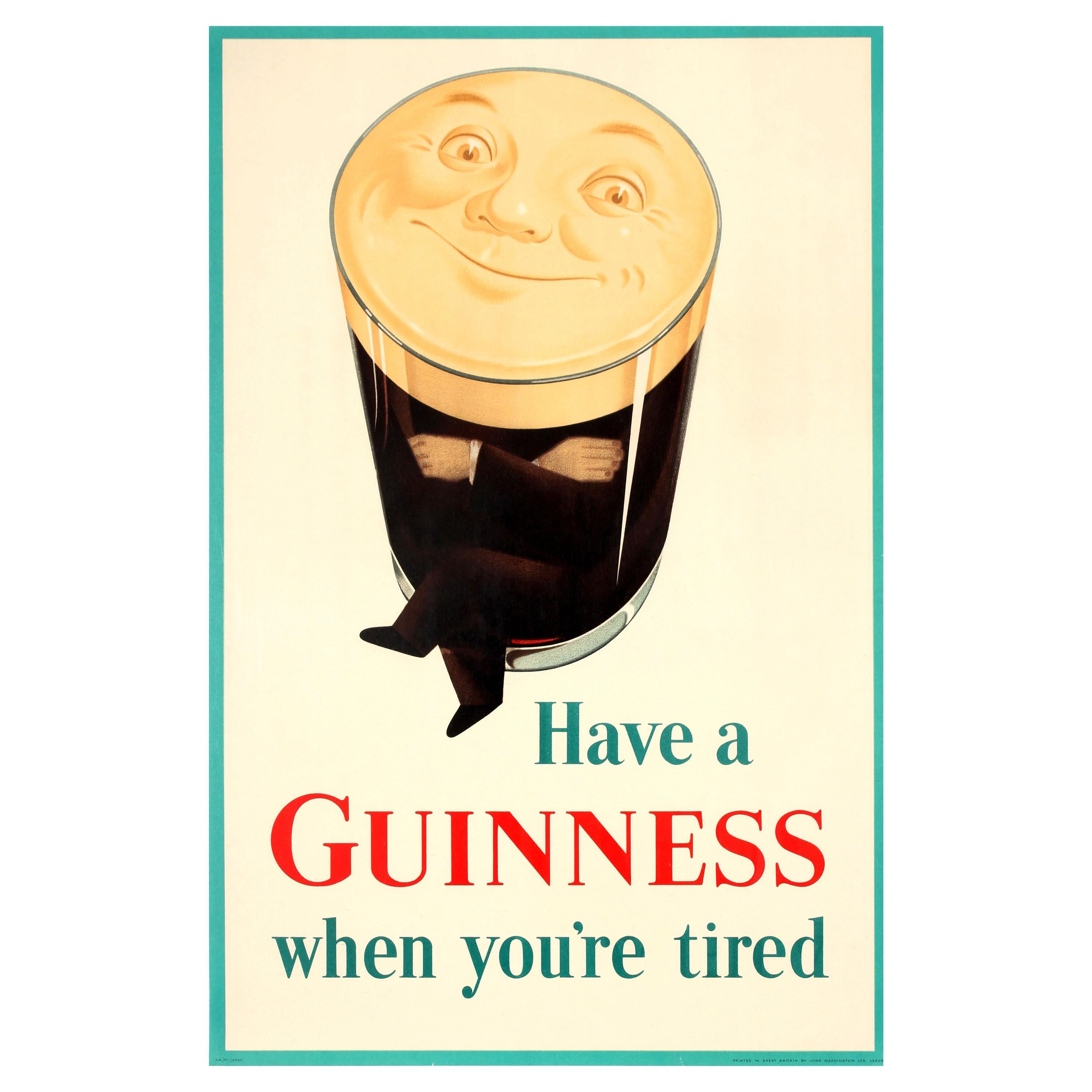 Original vintage iconic drink advertising poster for Guinness Irish stout beer - Have a Guinness when you're tired - featuring a classic image of a pint glass of Guinness as a man with his arms and legs crossed and his face smiling out from the foam
