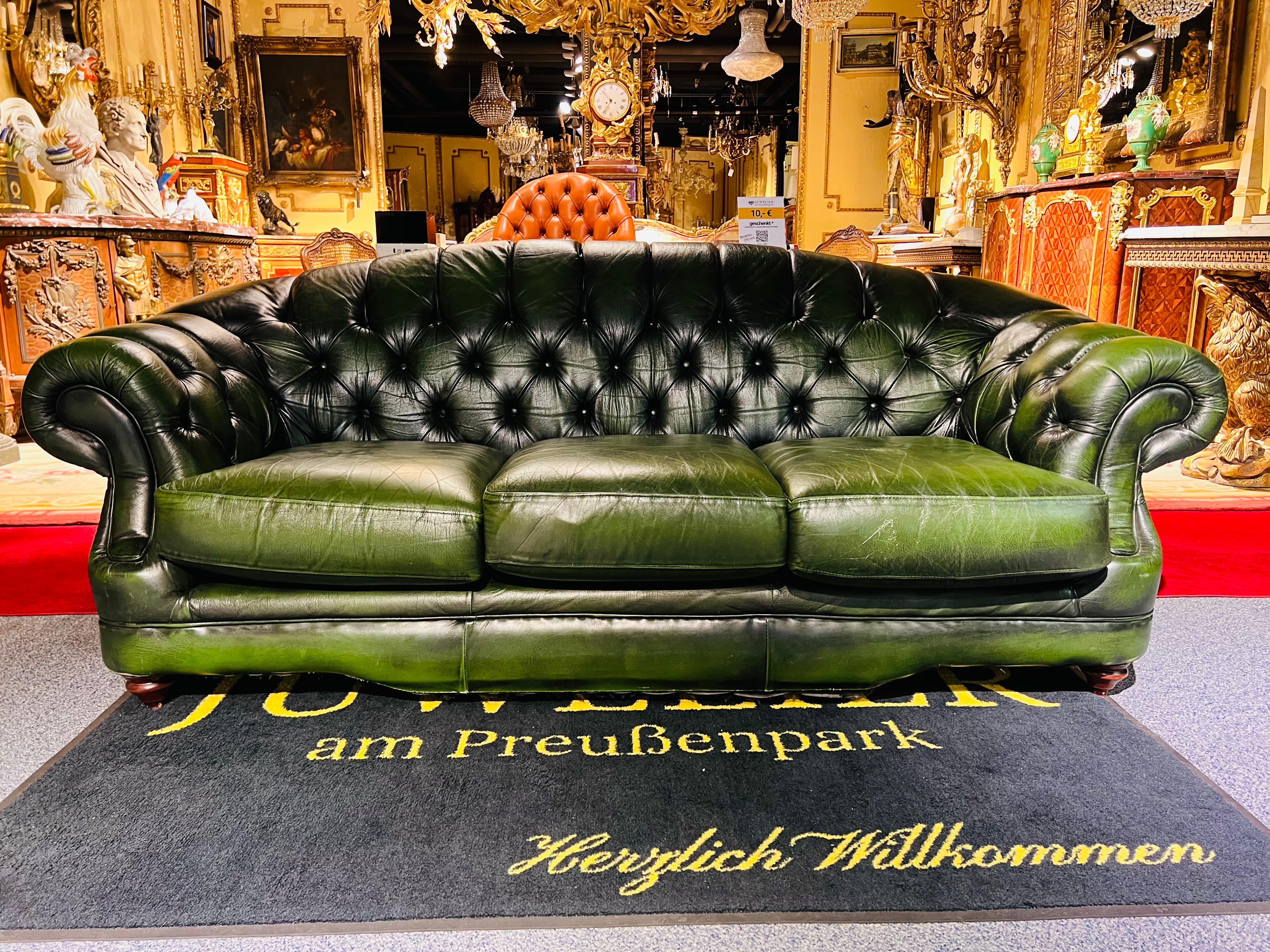 This original beautifully preserved dark green leather Large 3-seater sofa is very masculine and big enough for an office. Coil sprung feather filled cushions - Vintage green leather Chesterfield sofa with original coil sprung front edge and feather