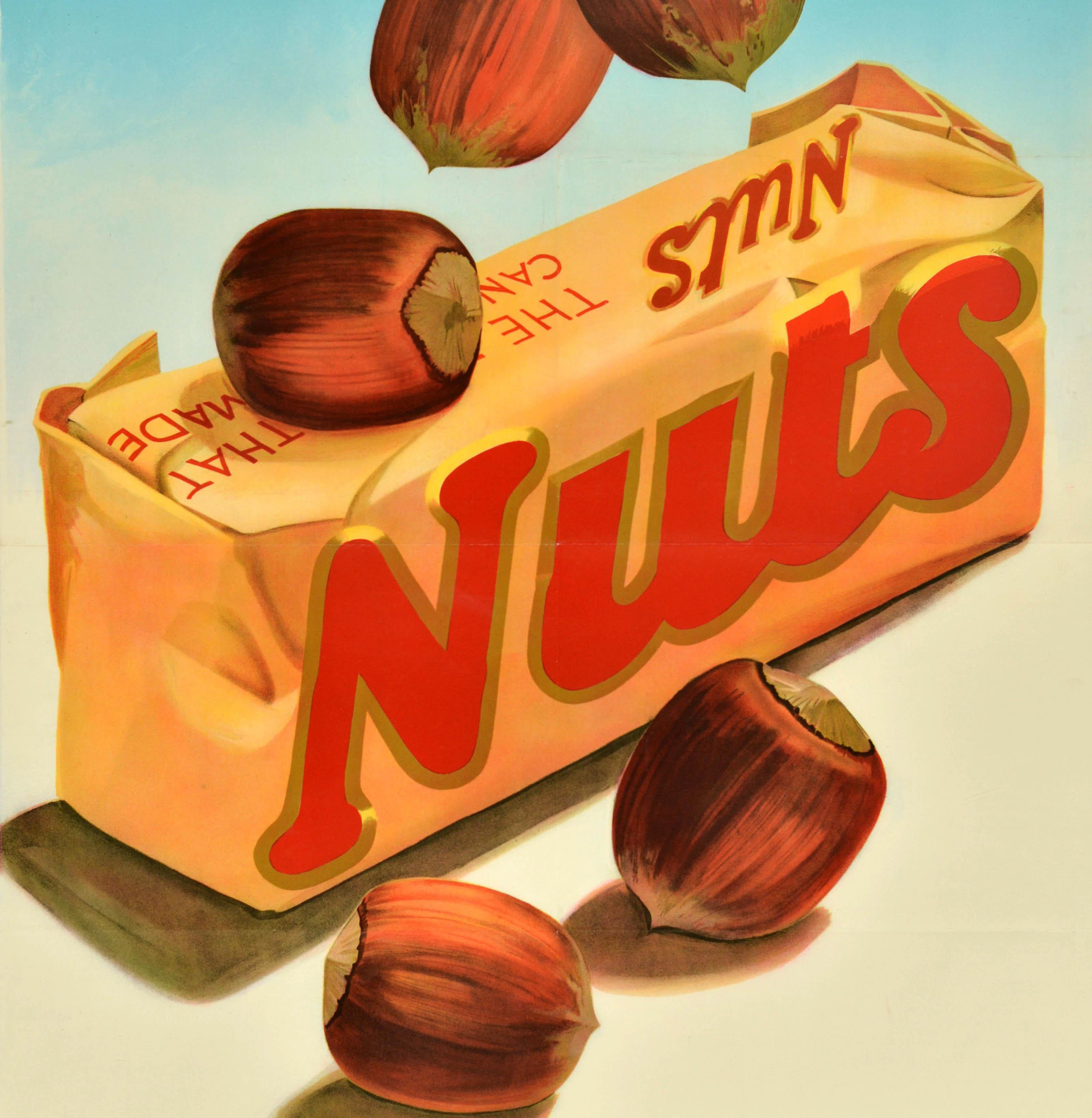 Original vintage food advertising poster for Nuts featuring an illustration by the Dutch artist Frans Mettes (1909-1984) depicting hazelnuts falling on a golden sweet wrapper set on a light blue and white background, the slogan below - un produit