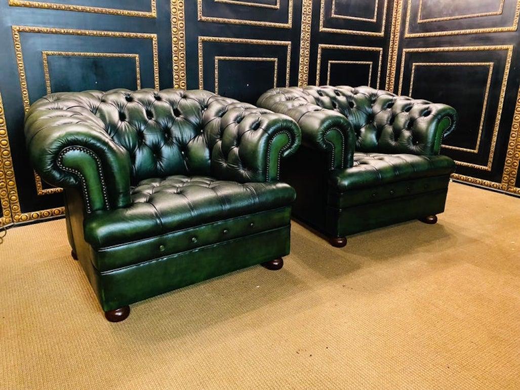 We are delighted to offer this stunning very rare handmade in England green leather armchairs. Where to begin! This suite is absolute eye candy from every angle, it has the original leather hide, it has been hand dyed this lovely and bespoke green