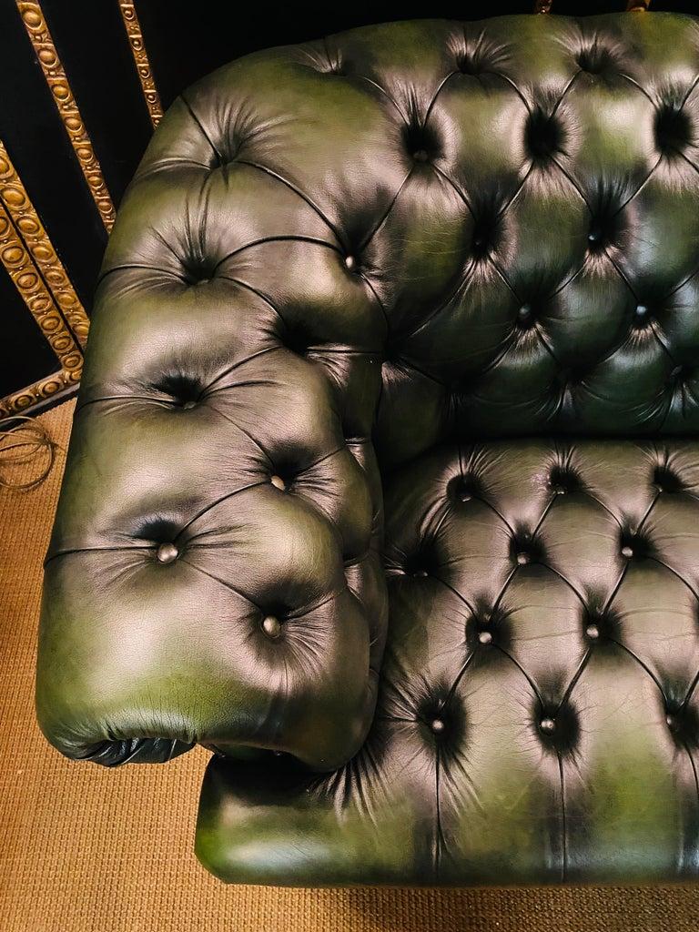 We are delighted to offer this stunning very rare handmade in England green leather sofa. Where to begin! This suite is absolute eye candy from every angle, it has the original leather hide, it has been hand dyed this lovely and bespoke green