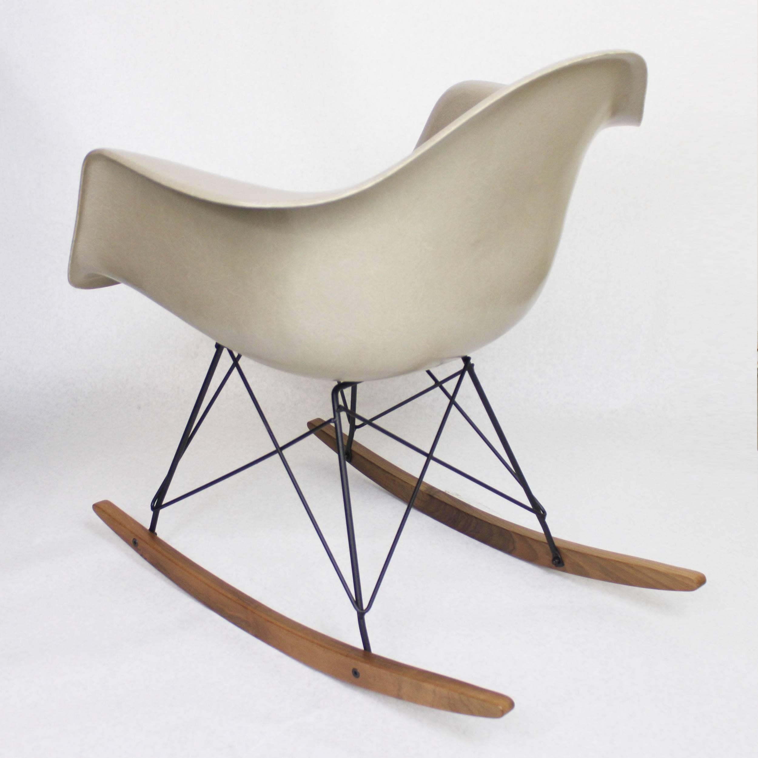 This is a wonderful original example of the Eames shell chair in one of the most desirable vintage colors offered, 'Greige'. This chair is in spectacular condition with only very, very minor scuffs anywhere on the fiberglass. Shell has been paired