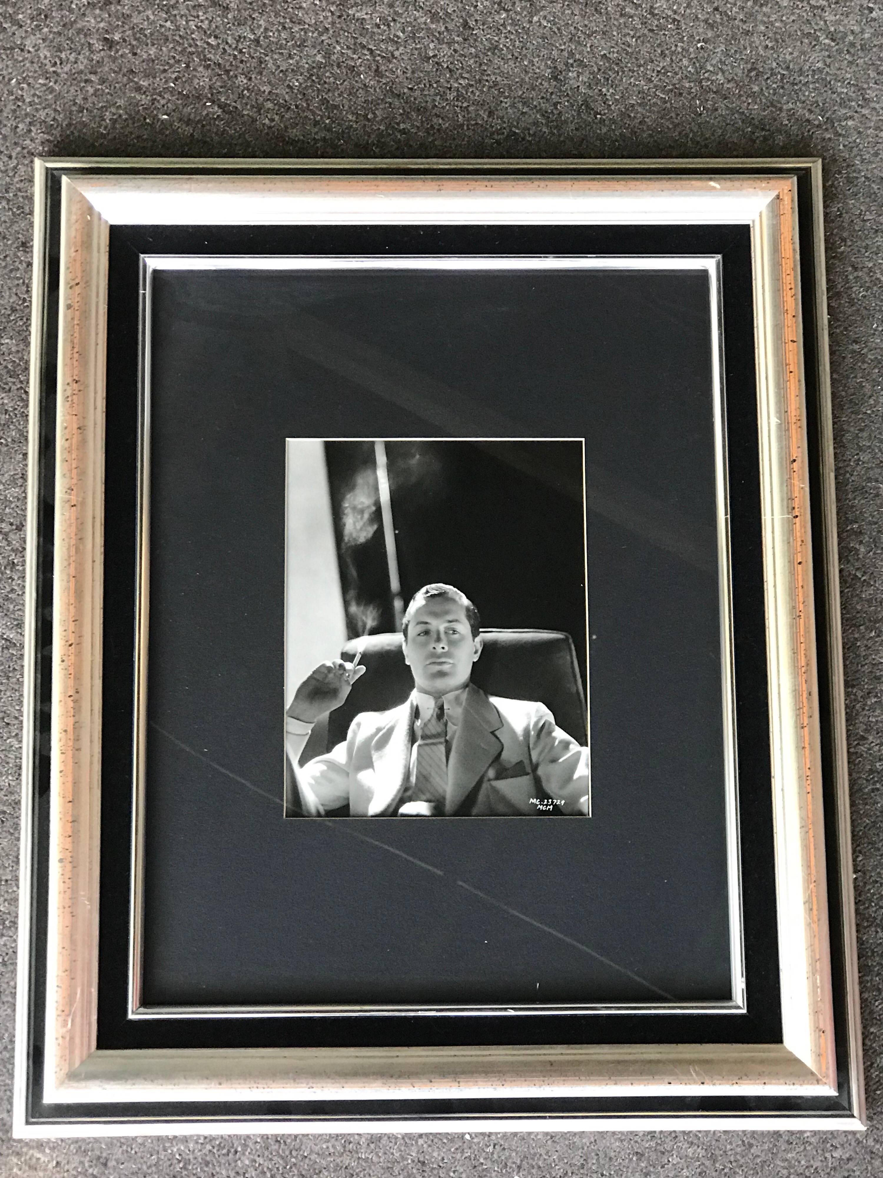 A beautiful old Hollywood glamour portrait of the very handsome actor, Robert Montgomery. This photograph was printed decades ago from the original negative by famed celebrity photographer, Clarence Sinclair Bull. The photo is unsigned with