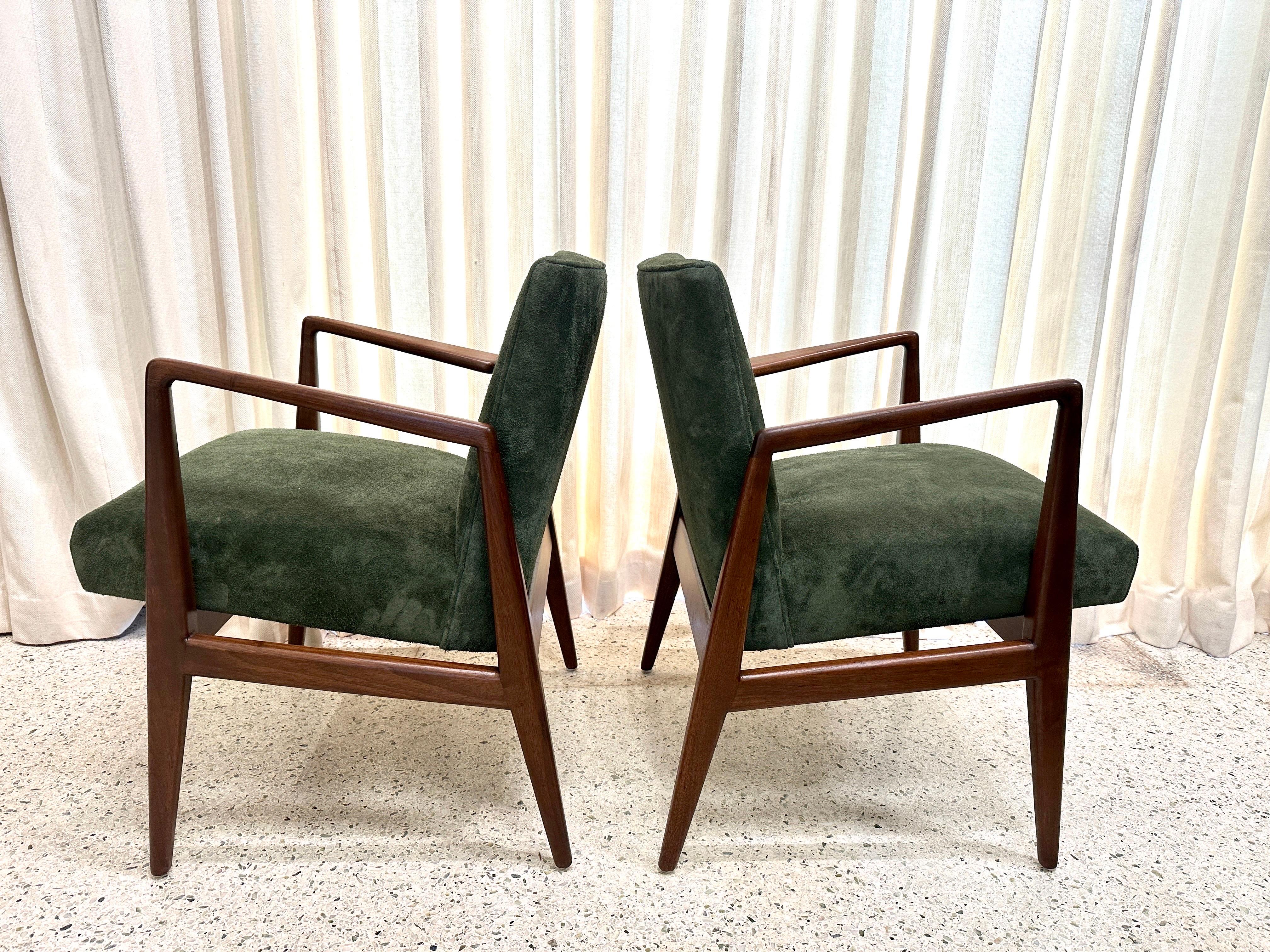 Wonderful authentic labelled vintage Jens Risom armchairs in Walnut frame and upholstered in a sumptuous Rolex green suede.  The walnut frame has been lovingly refinished to its original luster.  THIS ITEM IS LOCATED AND WILL SHIP FROM OUR MIAMI,
