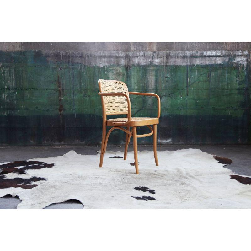 Mid-Century original bentwood beech Prague Armchair model 811 designed in the 1920's by Austrian architect Josef Frank and Josef Hoffman for Thonet. The chair is stamped made in Poland.
 
Feature stunning intricate cane inset seat and seat back.