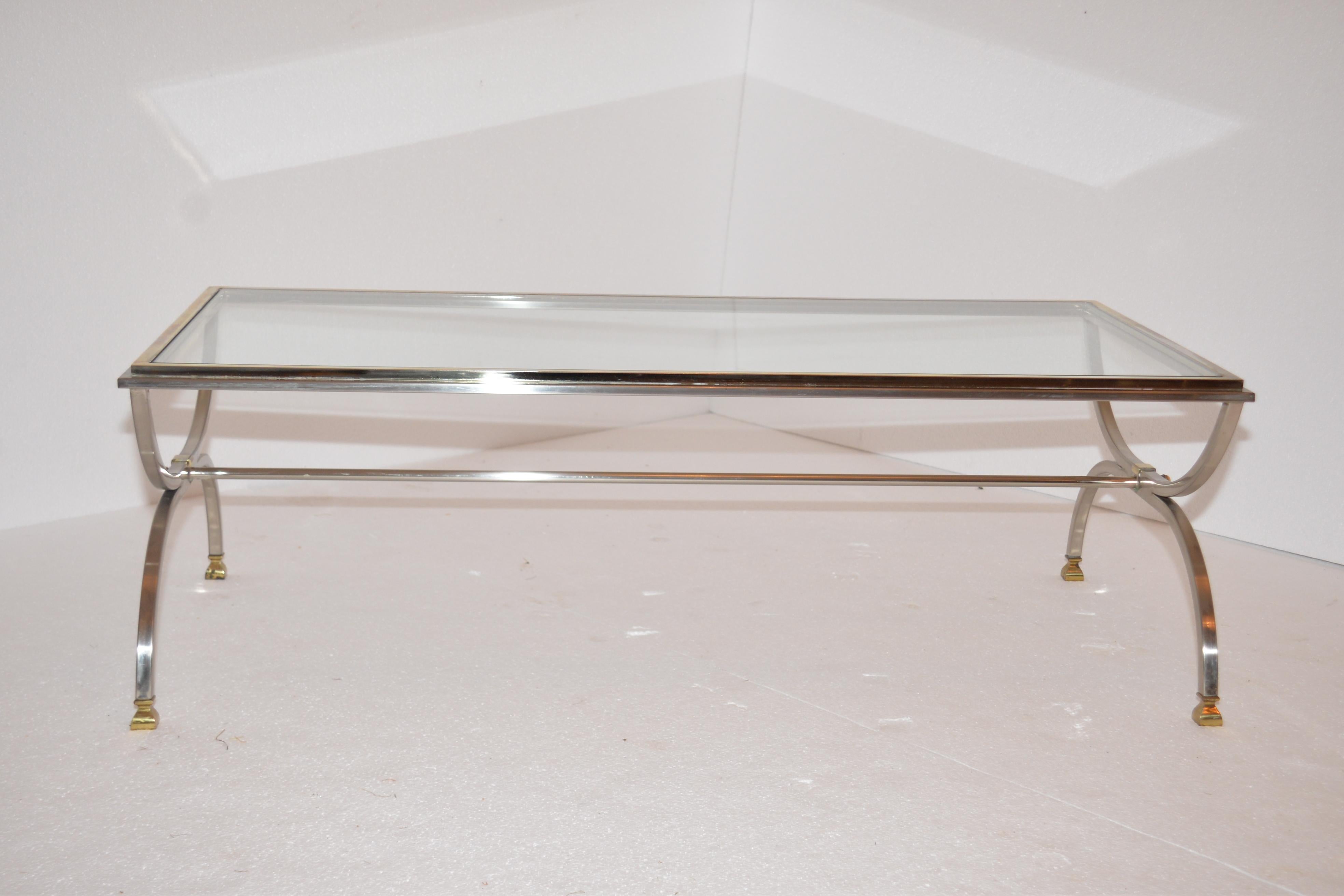A Maison Jansen chrome and brass coffee table. A fabulous genuine vintage item that would compliment any style of interior. This is a timeless Classic item from the famous French designer.