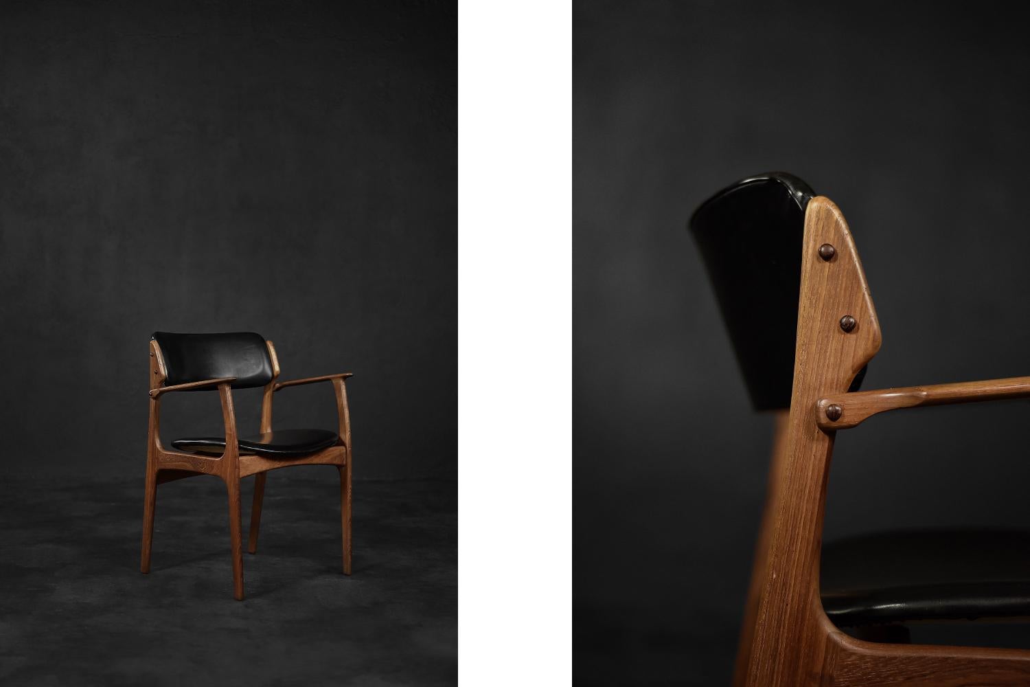 This model 50 office armchair was designed by Erik Buch for the Danish manufactory Oddense Maskinsnedkeri during the 1950s. The sculptured frame of the armchair is made of dark brown teak wood. The seat and backrest are upholstered in black vinyl.