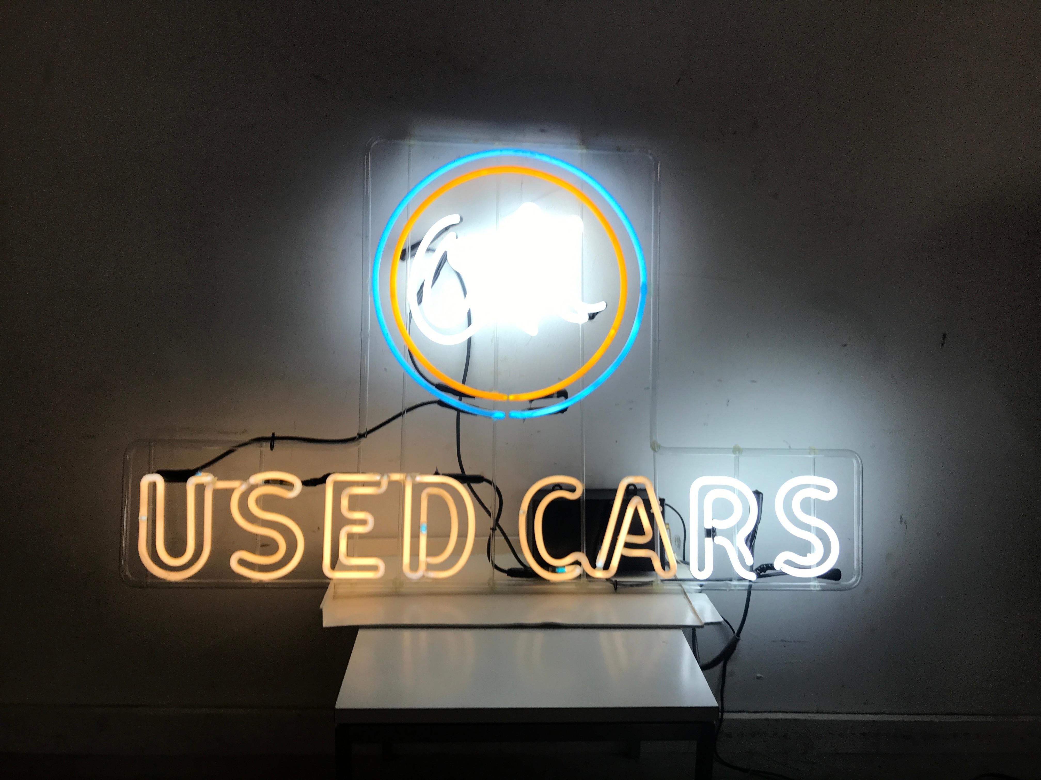 Original, large ok used cars neon sign, circa 1940s. Appears that the R and S have been repaired at some point, other then that all original neon, letters measure 8 inches high, OK 19 inches in diameter. Measures: 52