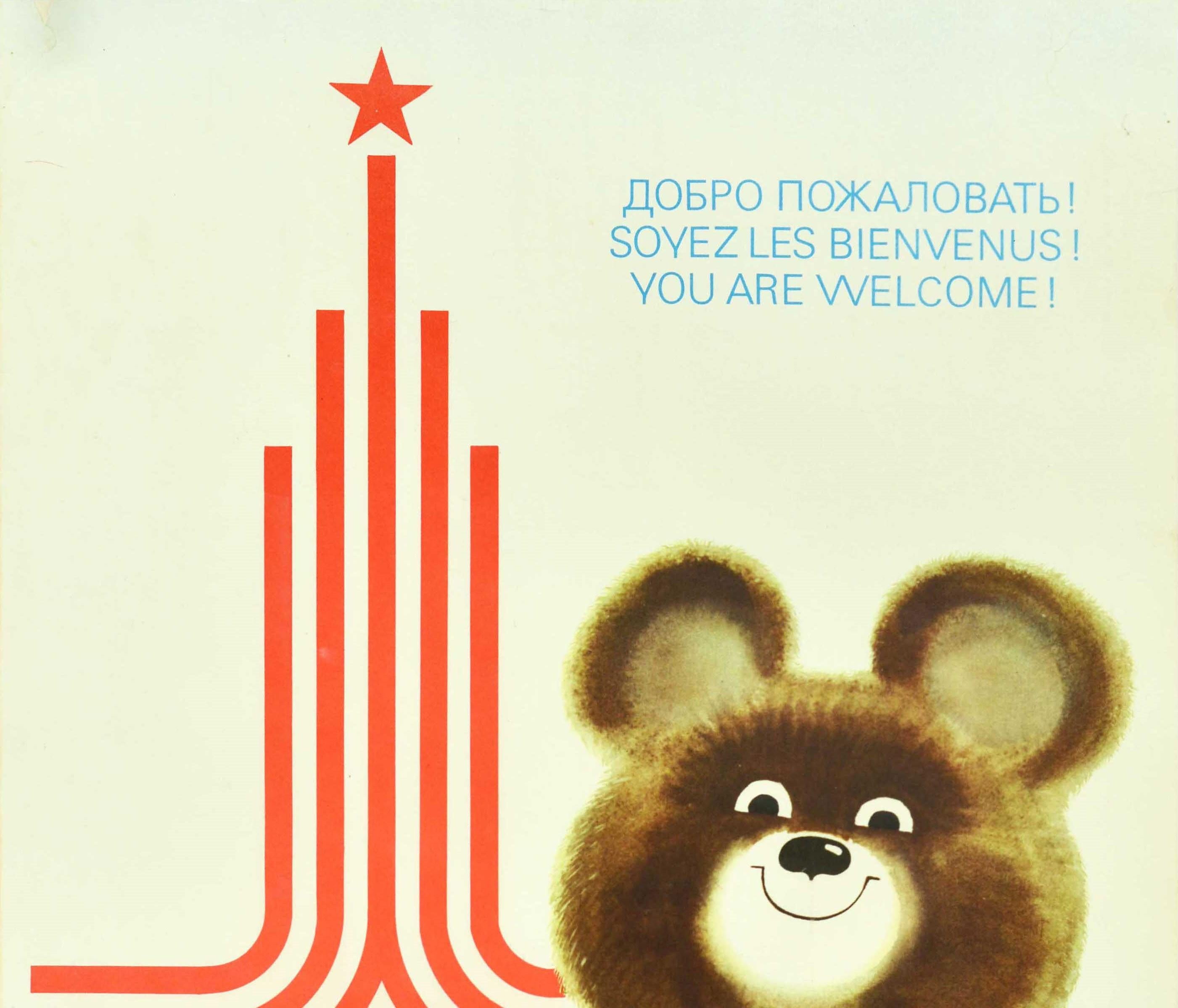Original vintage Soviet sport poster for the 22nd Summer Olympic Games (Games of the XXII Olympiad) in 1980 held in Moscow Russia featuring a fun and colourful illustration depicting a smiling bear - Misha the Moscow Olympic Games mascot - wearing