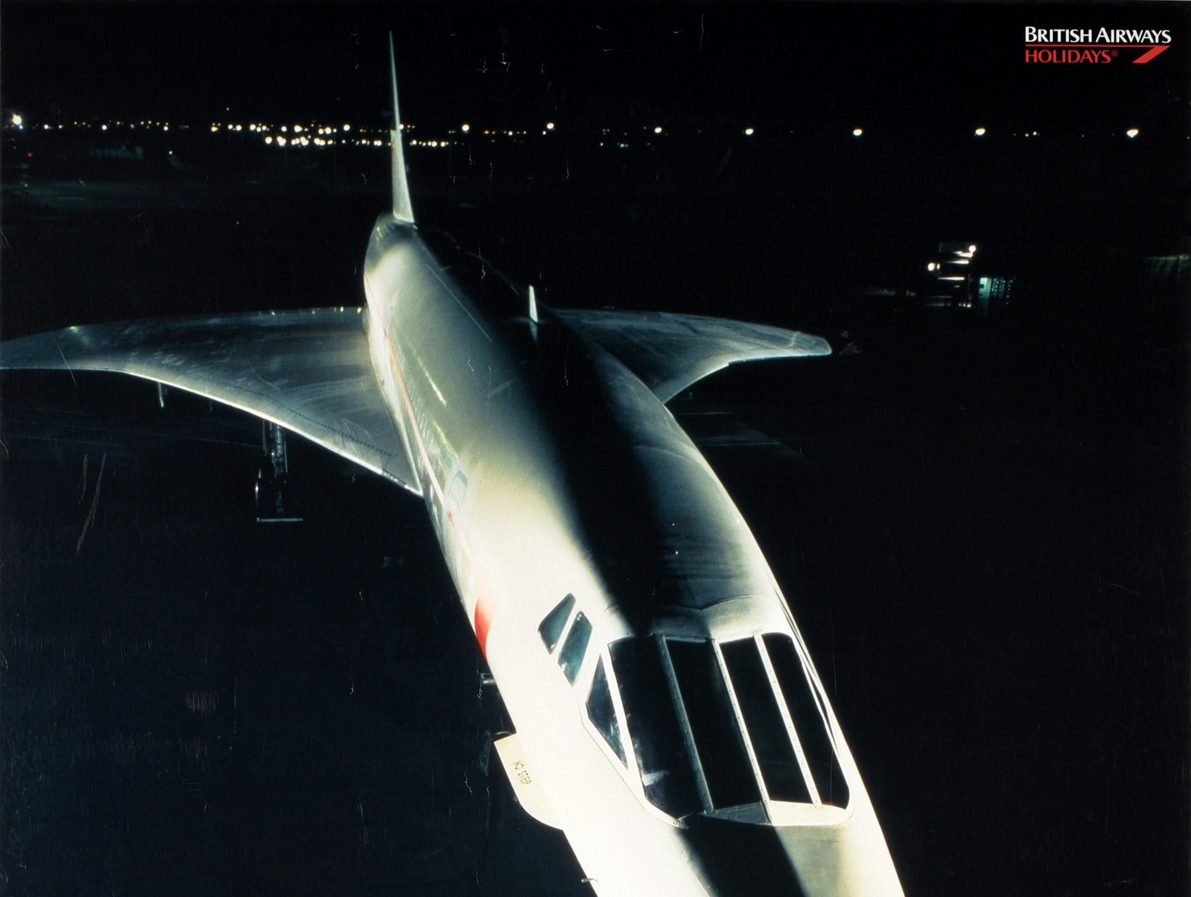 Original vintage travel advertising poster for Concorde Vacations British Airways Holidays featuring a great image of an iconic Concorde plane flying at night towards the viewer with lights visible on the black background, the text below and above