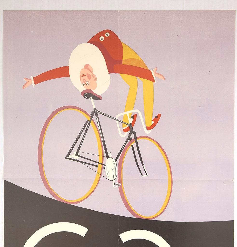 Original vintage Polish circus advertising poster - Cyrk - featuring a fun and colourful image of an acrobat clown performing a balancing act backwards on a bike with his head on the seat whilst steering the bicycle with his feet against the pale