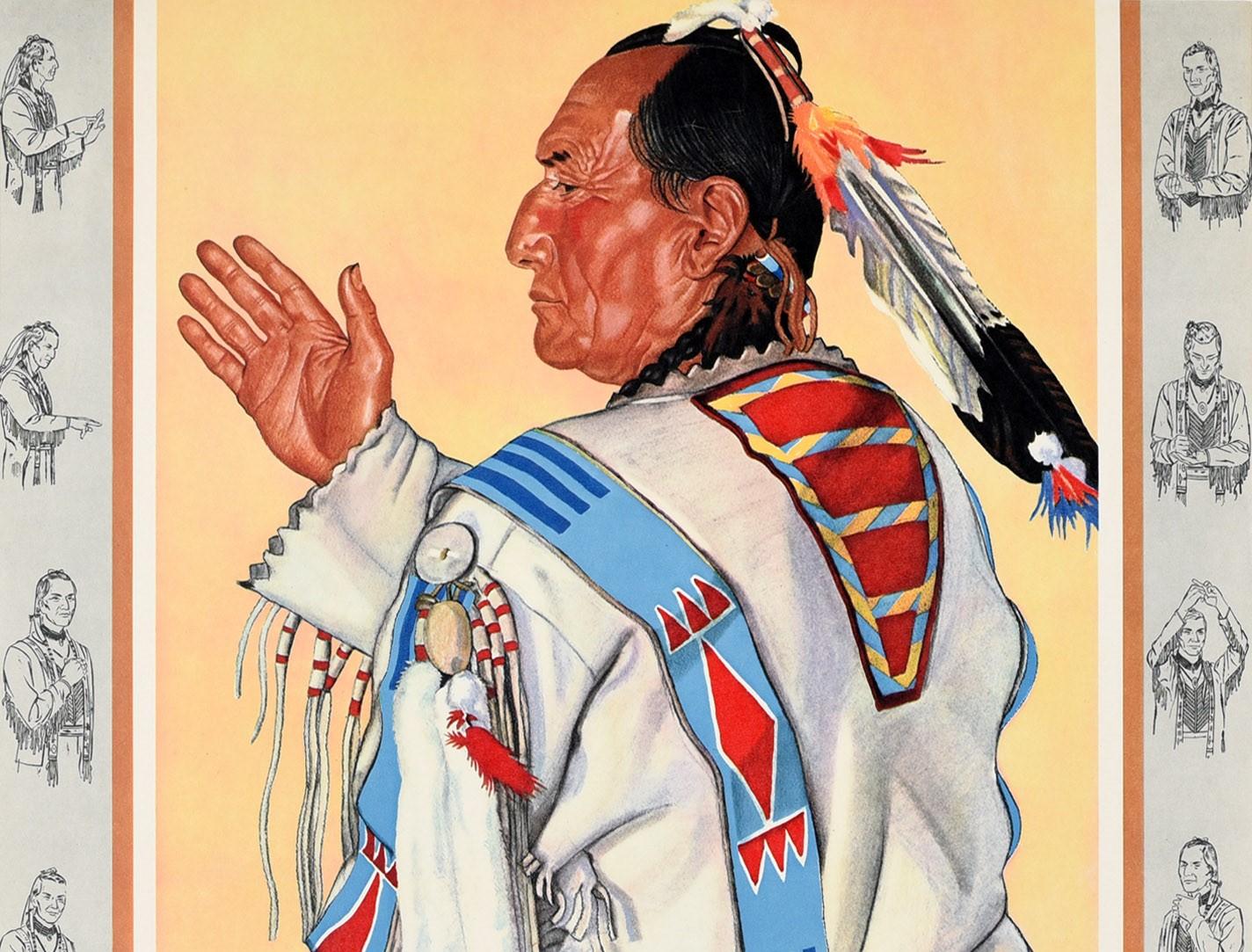 Original vintage travel advertising poster - Great Domes of the Incomparable Empire Builder - featuring a native American man wearing traditional clothing with a colourful bird feather headdress sitting on a red cushion and holding his hand up in