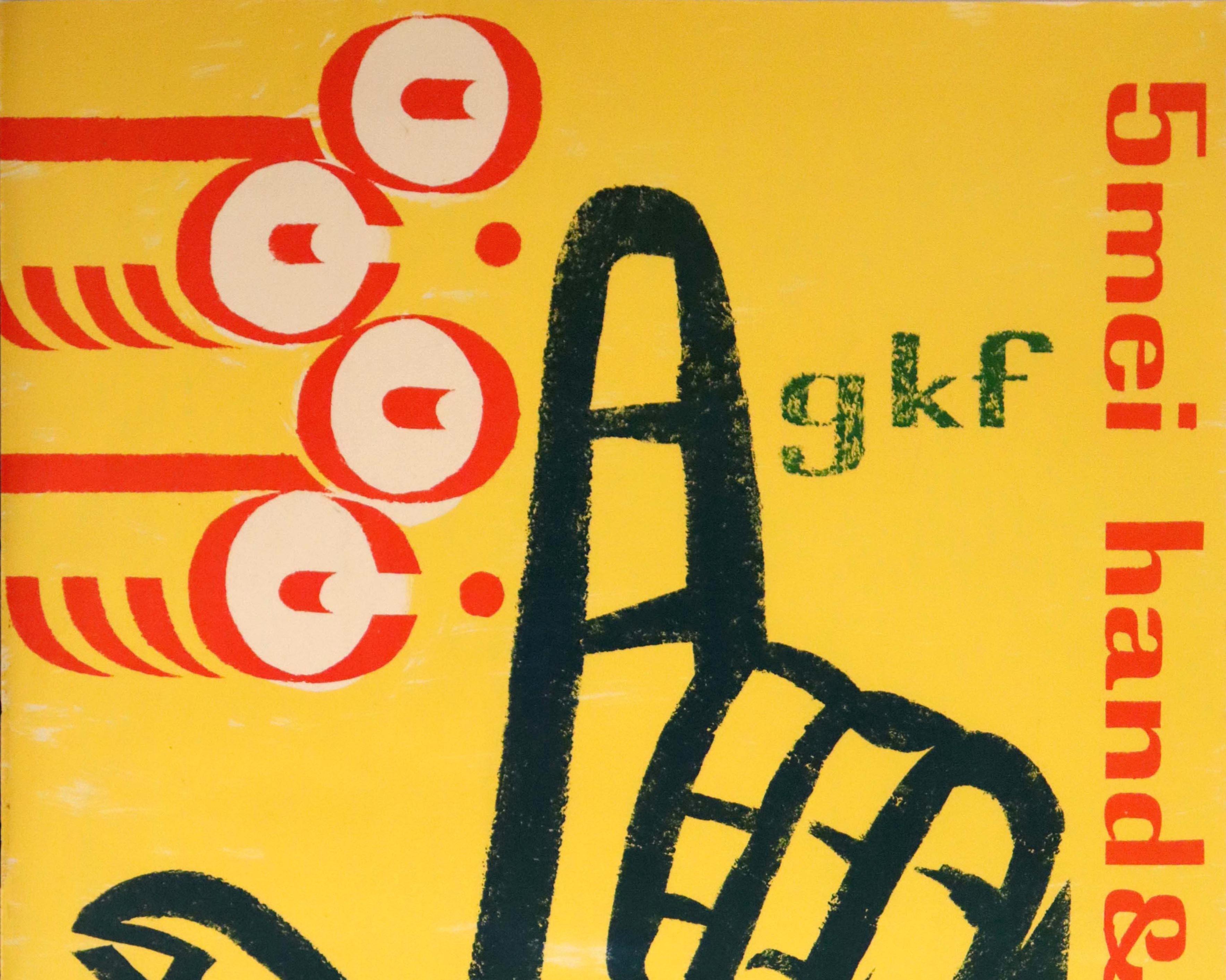 Original vintage advertising poster for the GKF 5 Mei Hand & Machine exhibition at the Stedelijk Museum in Amsterdam featuring a mid-century illustration of a hand in black with a finger pointing up next to red and white shapes against the yellow