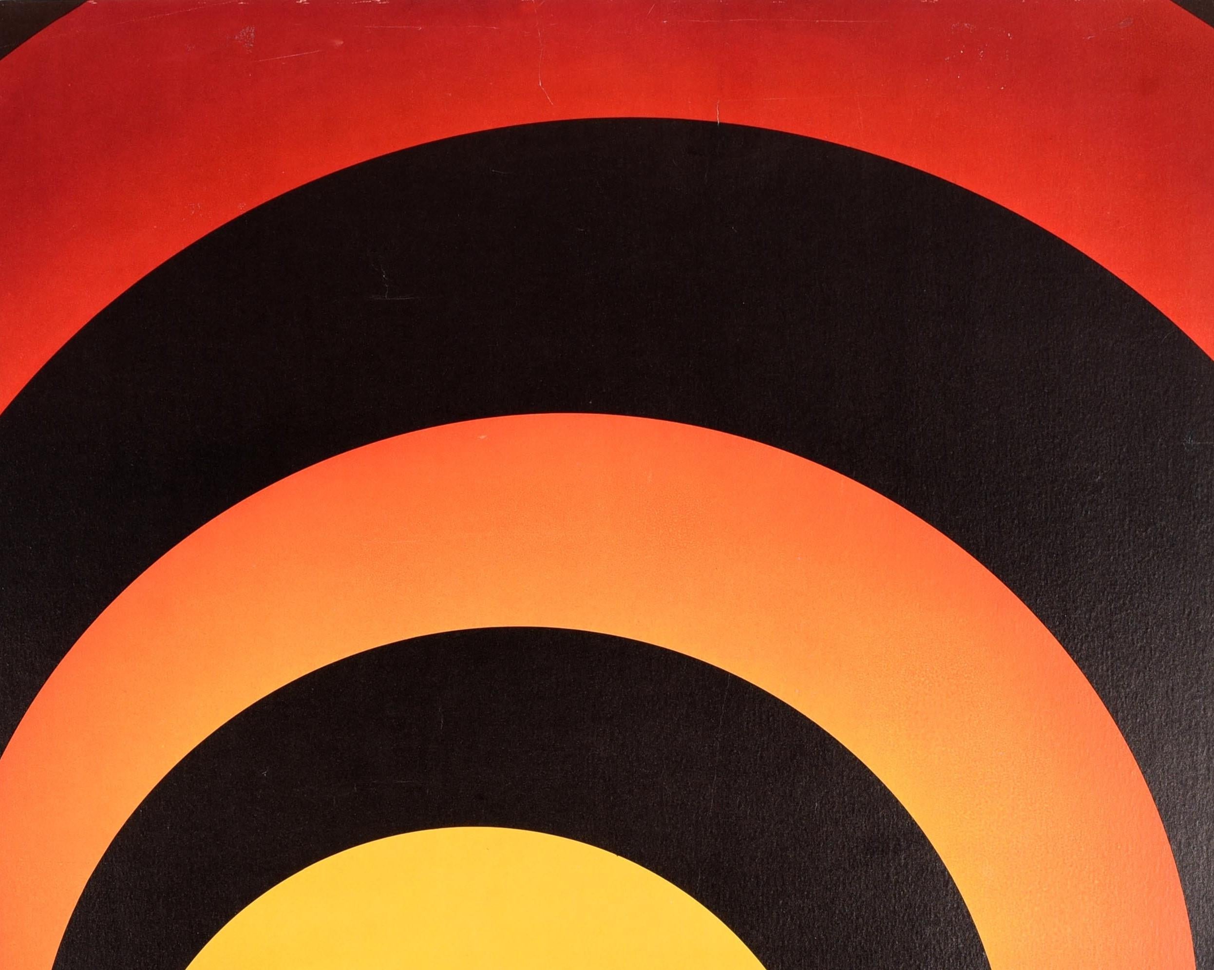 Original vintage travel poster for Japan issued by Pan Am featuring a great graphic design showing a lady dancing in the centre of a James Bond style target formed by black circles against a yellow, orange and red shaded background with the stylized