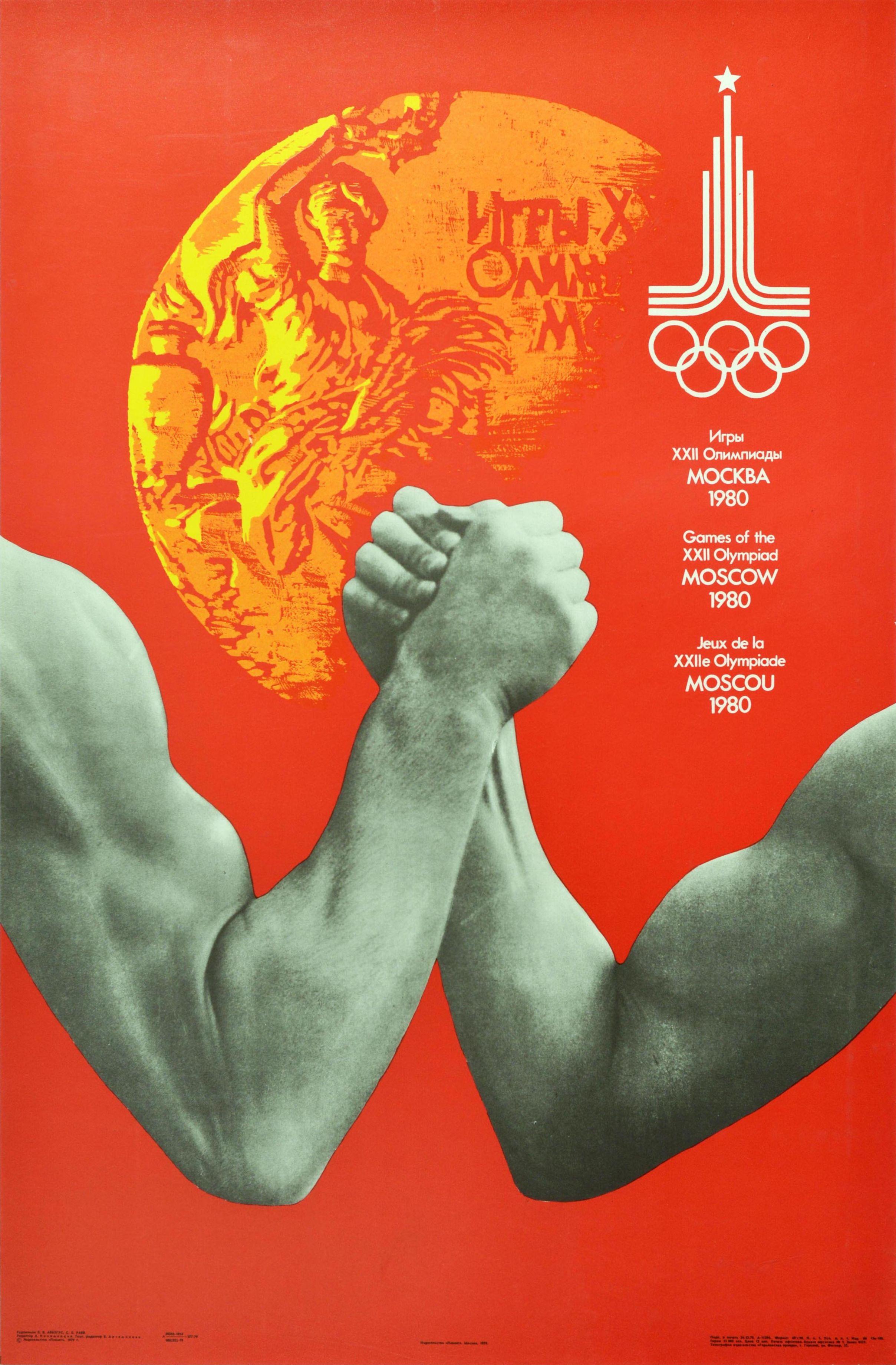 Original vintage sports poster issued for the 1980 Summer Olympic Games in Moscow Russia featuring a black and white photograph of two strong arms interlocked in an arm wrestle representing the arm wrestling tournament with an illustration of a Gold