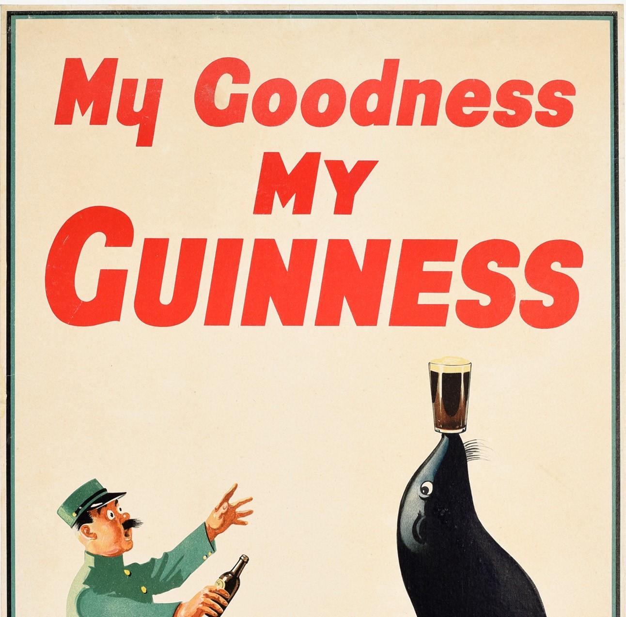 Affiche publicitaire vintage originale pour la boisson emblématique Guinness, la bière stout irlandaise - My Goodness My Guinness - présentant une image amusante d'un gardien de zoo surpris en uniforme courant avec sa bouteille de Guinness vers une