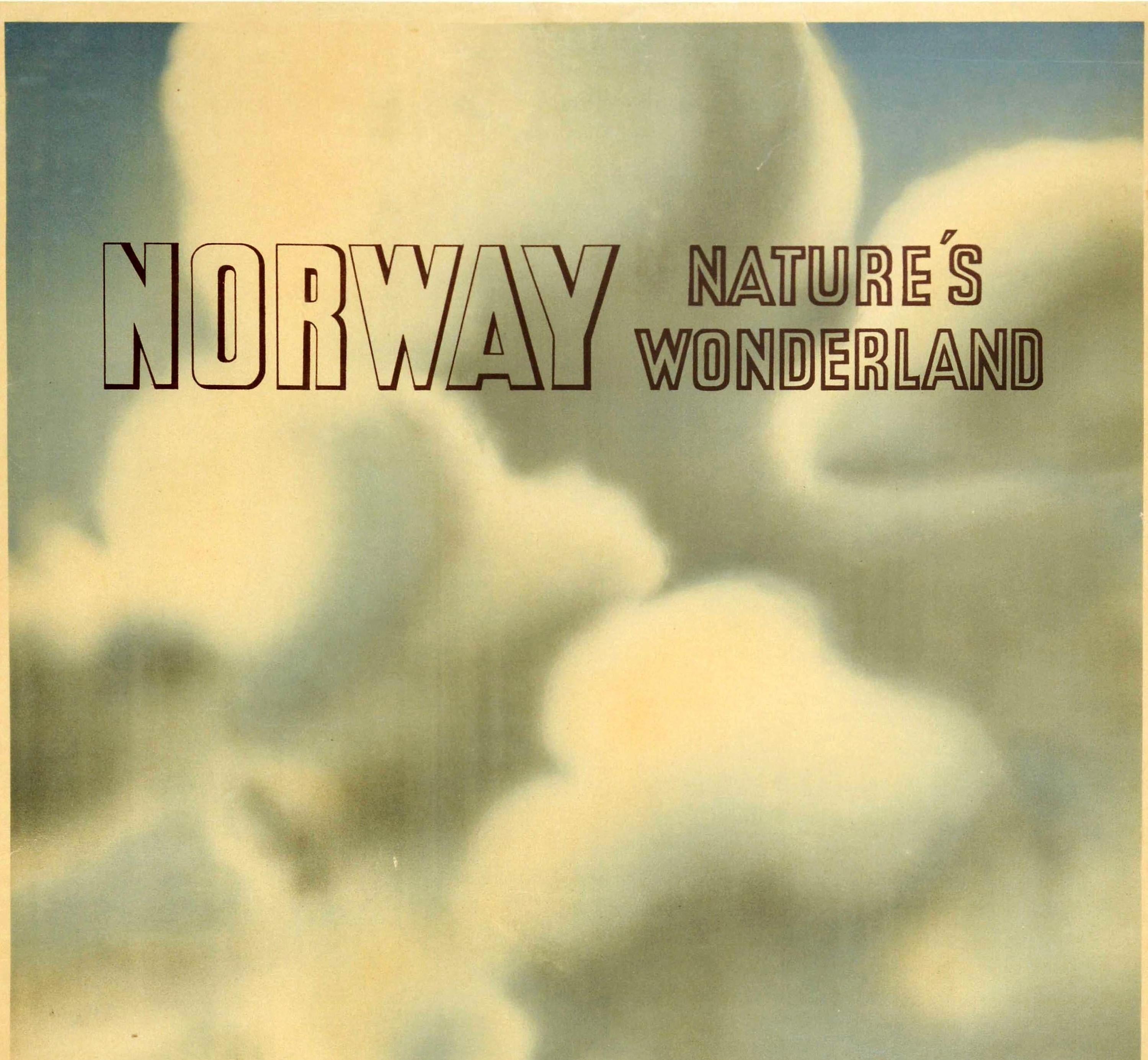 Original vintage travel poster for Norway Nature's Wonderland featuring a scenic image of a couple on top of a hill pointing to trees and mountains in the distance with the stylized lettering above in front of clouds in the background. Published by