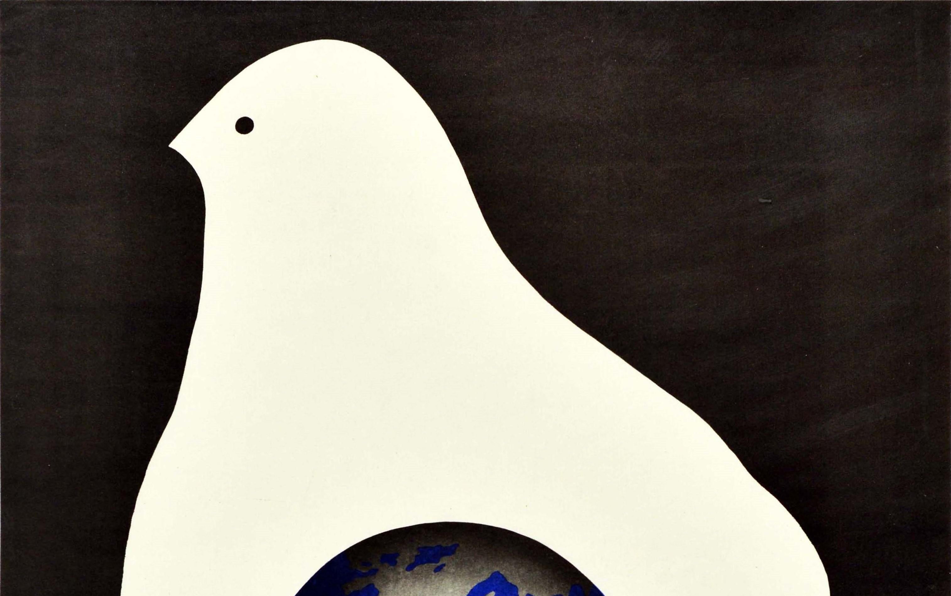 Original vintage Soviet propaganda poster featuring an illustration of a hand in white forming the shape of a peace dove holding planet Earth against a black background, the text below in white lettering - ??? ???? ???? ? ??????? / Peace is