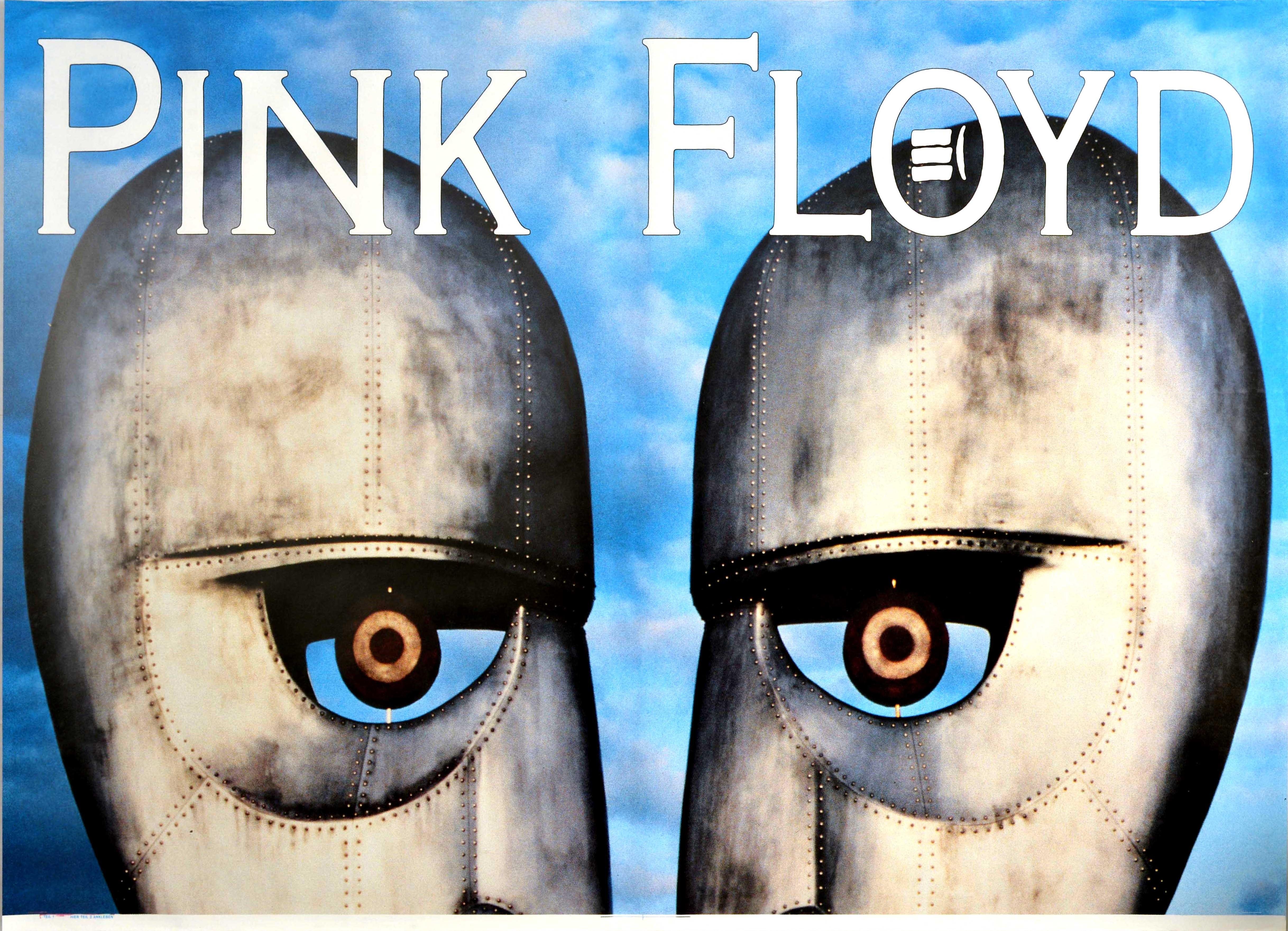 Original vintage two-sheet music advertising poster for the English rock band Pink Floyd The Division Bell new album released in 1994 featuring an image of two metal head statues facing each other forming a third face looking at the viewer against